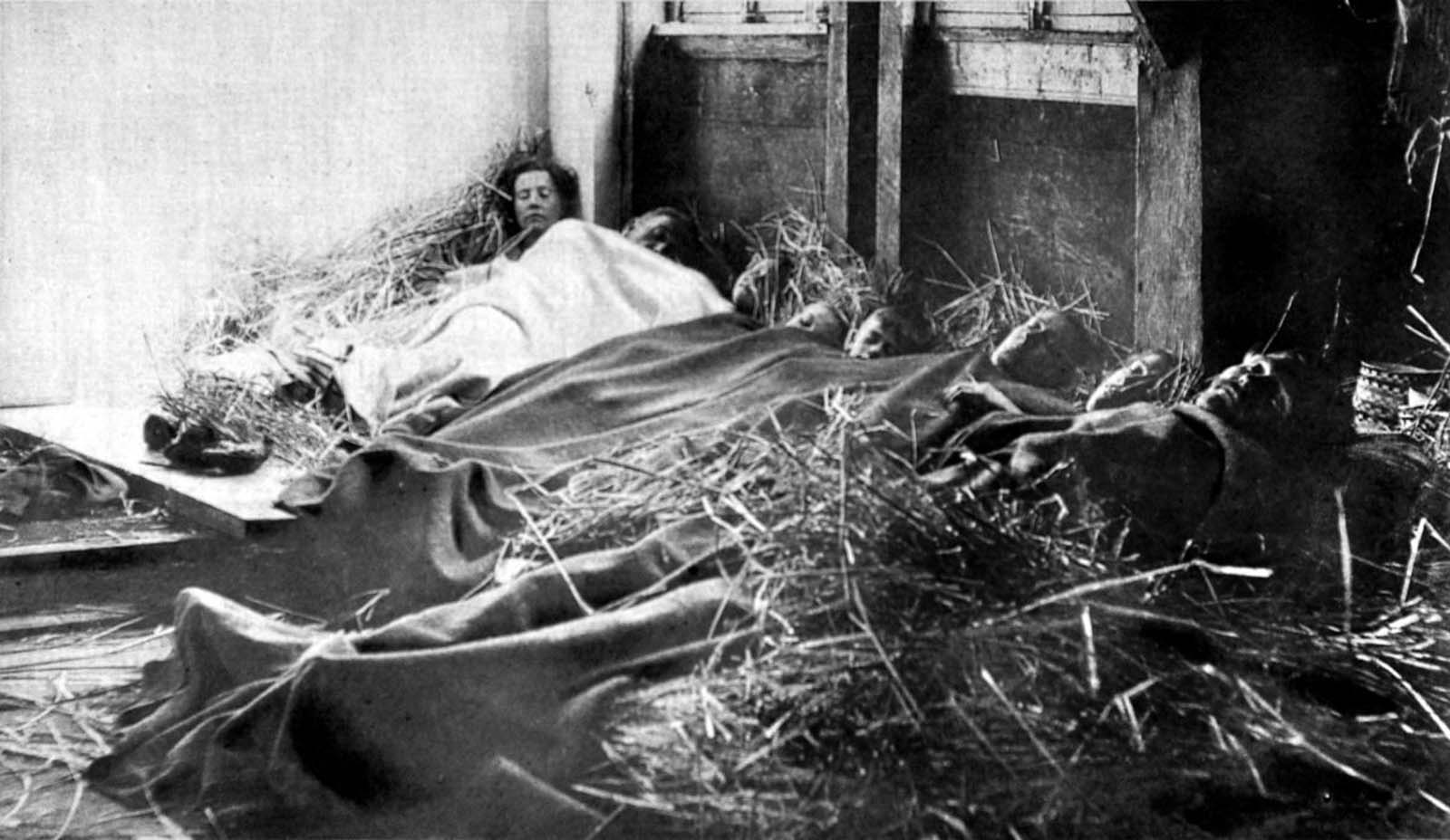 Belgian refugees sleep in a barn in France on Christmas Eve. 1914.