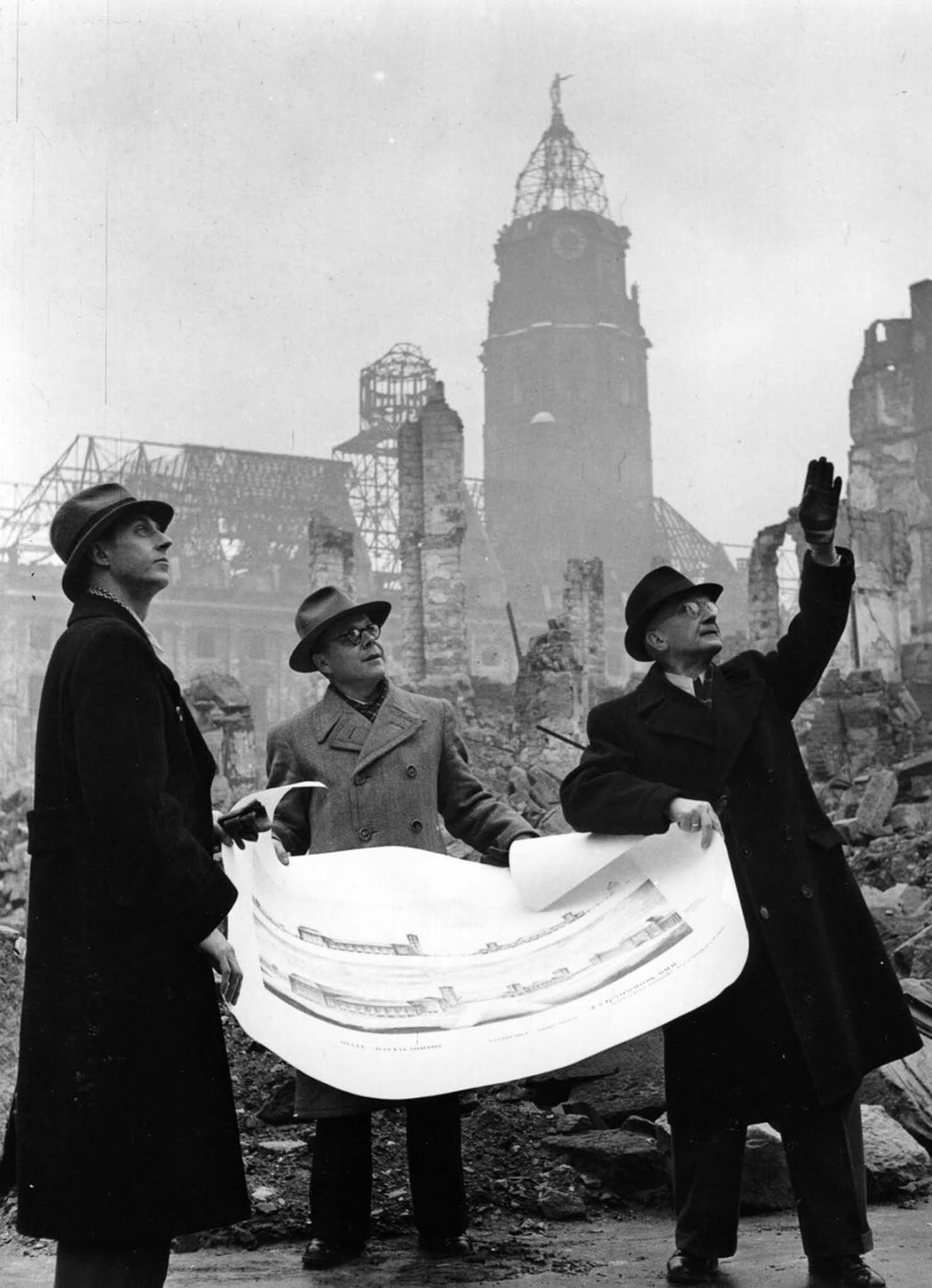 Propaganda director Heinz Grunewald, Mayor Walter Weidauer and architect Dr. C. Herbert discuss plans for rebuilding the city. 1946.