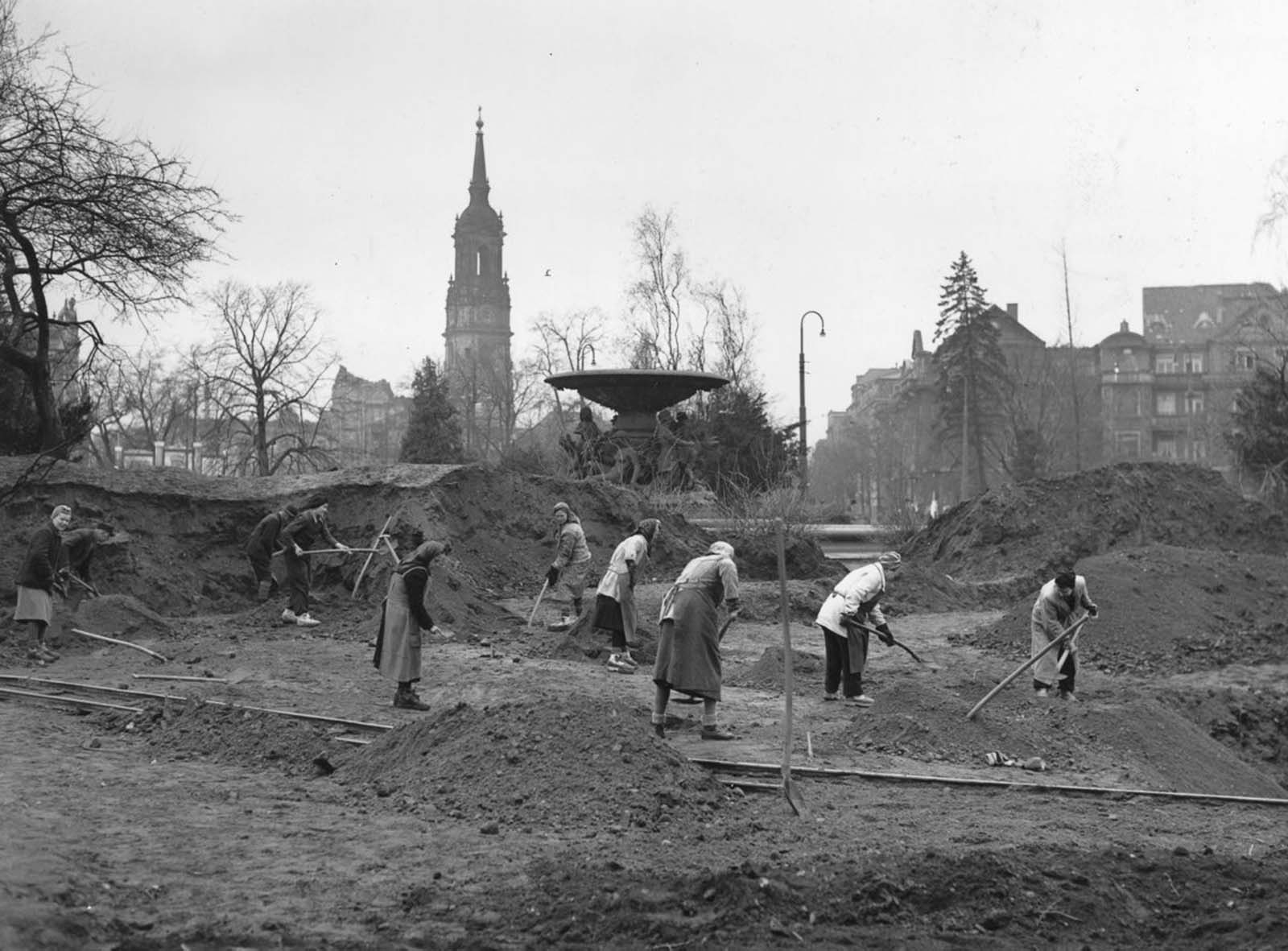 Volunteers spend a Sunday morning clearing rubble. 1946.