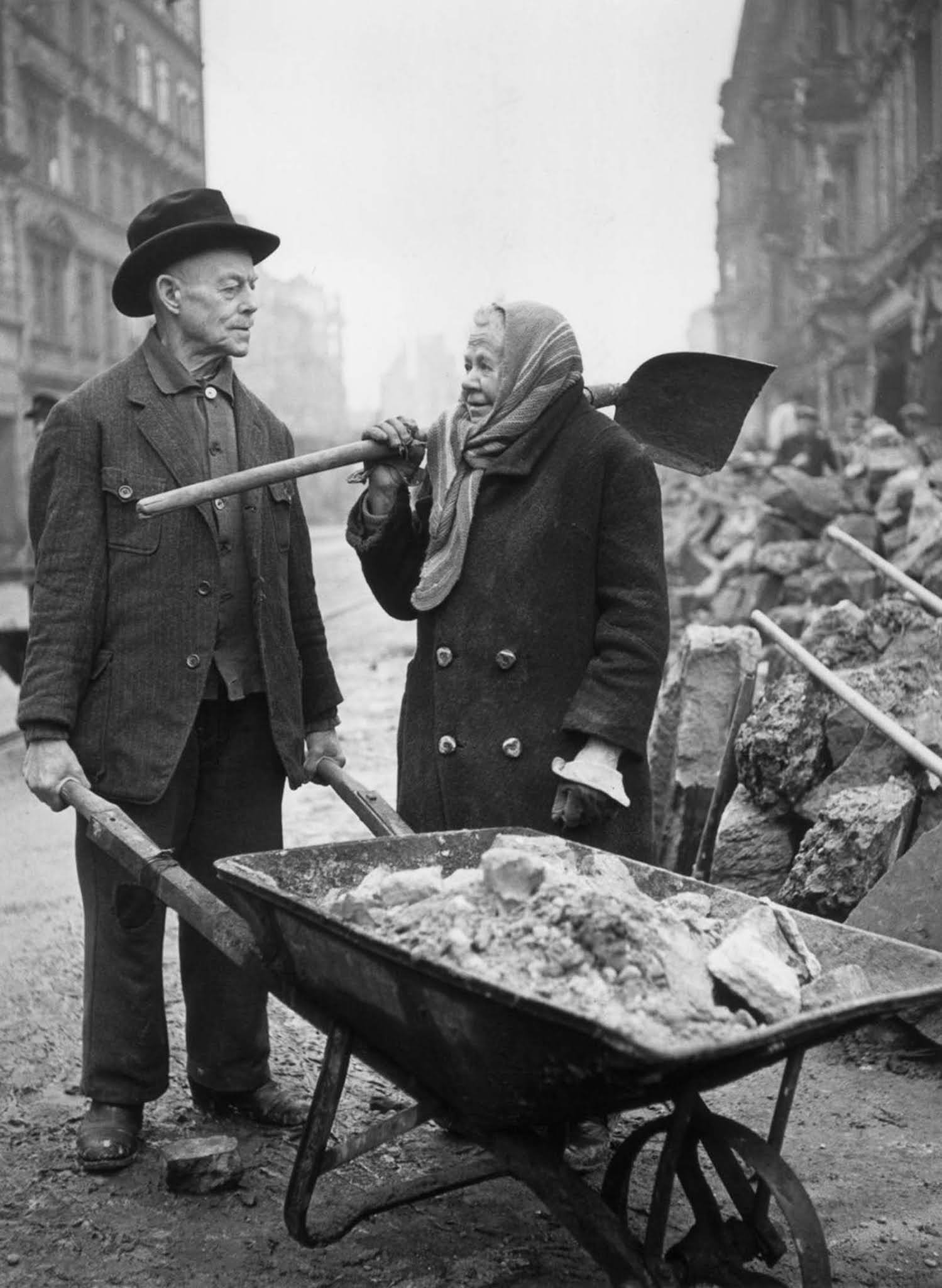 Gustav and Alma Piltz help clear rubble. 1946.