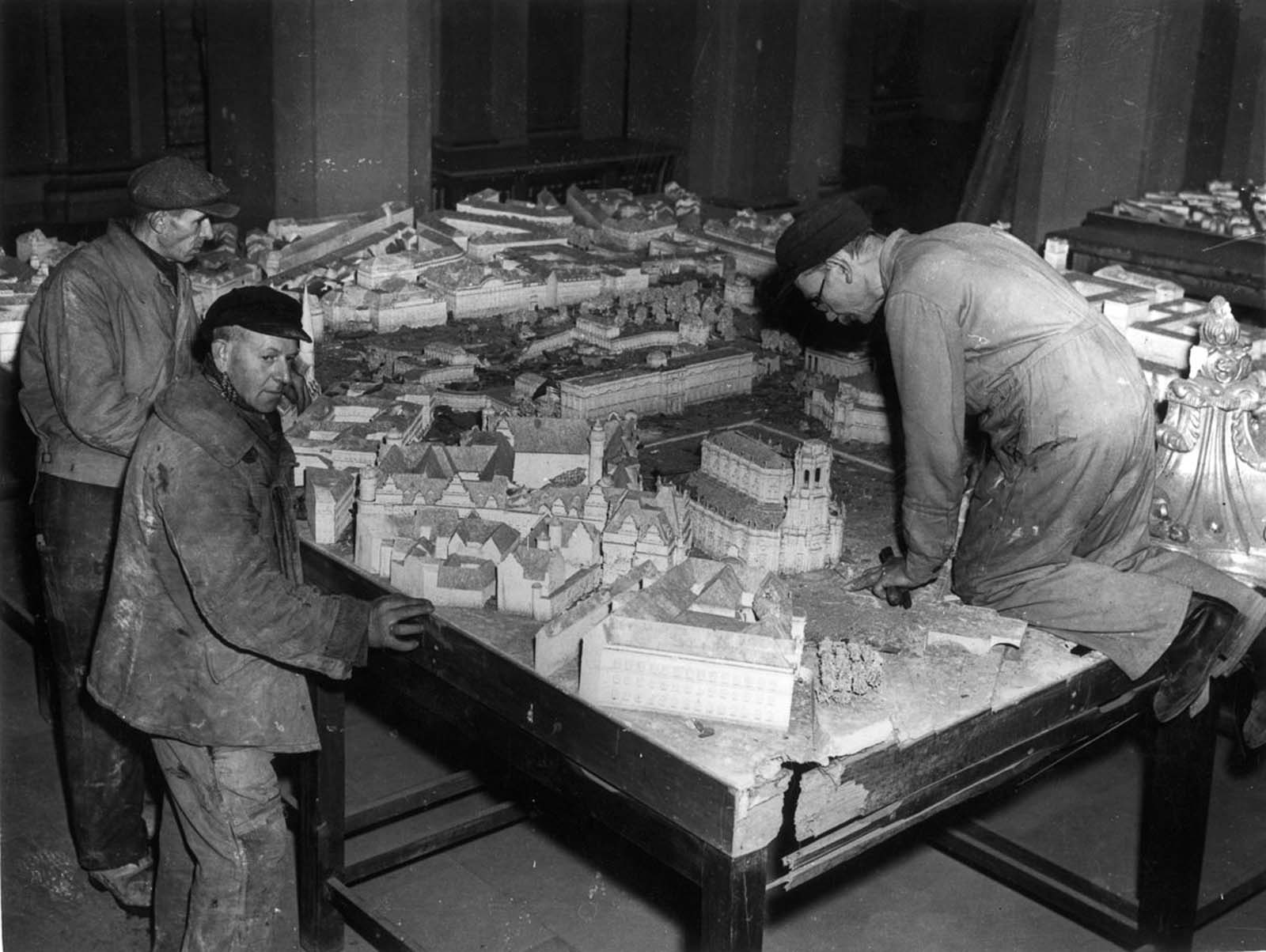 Workmen assemble a scale model of Dresden as it should look in 1958 after its reconstruction by the Russian occupying forces. 1946.