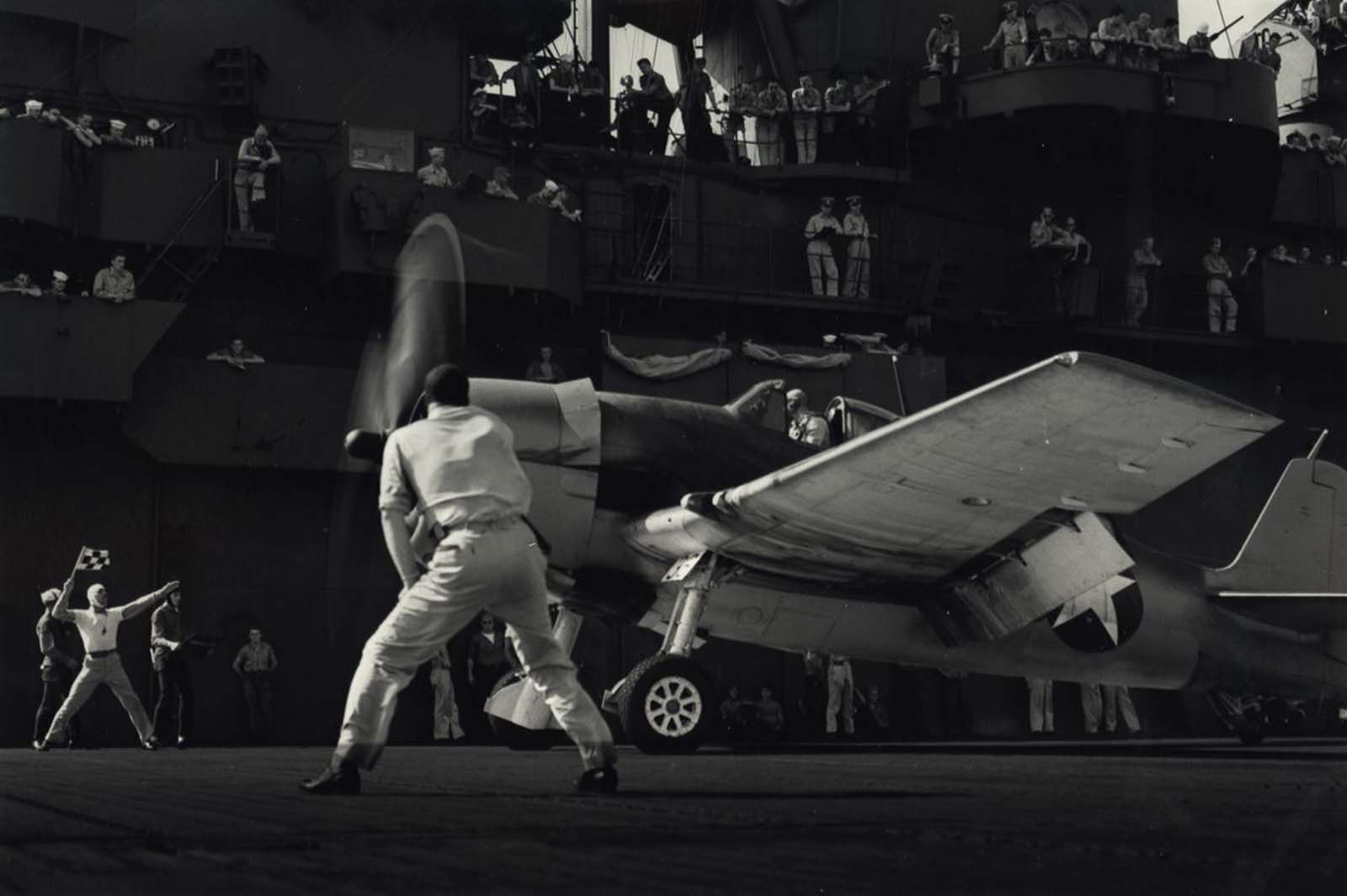 Sailors Watch as Aircraft Takes Off, c. 1943.