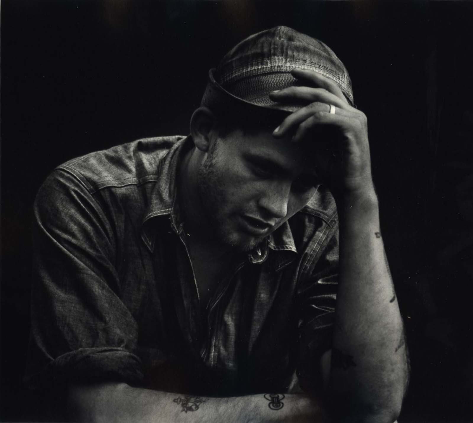 A man holding his hat, c. 1942-1945.