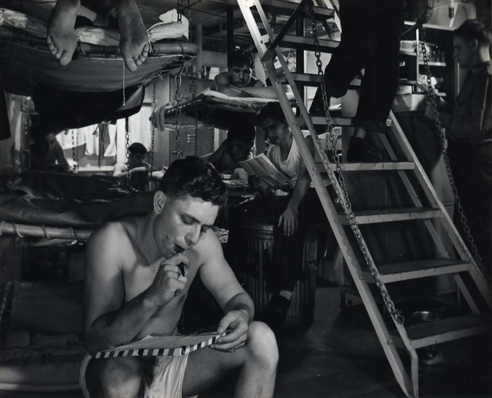 Crew reading and writing, c. 1942-1945.