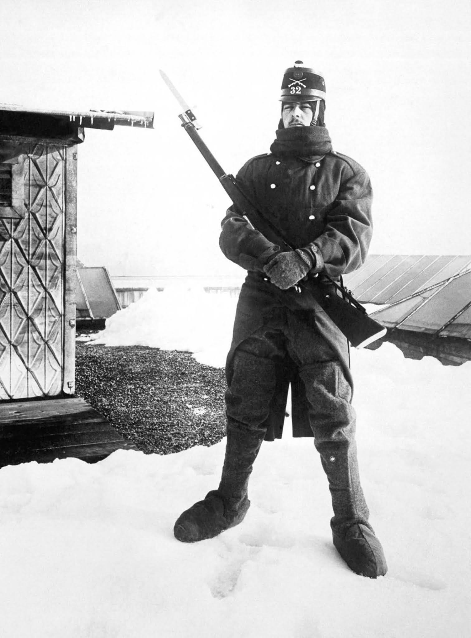 A Swiss soldier mans an army outpost in the high Alps where the war fighting between the Austrians and the Italians can be observed. 1918.