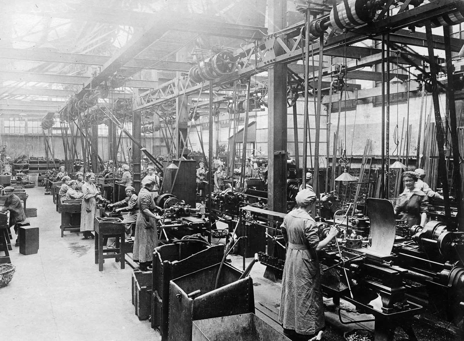 Workers build parts for boilers and condensers.