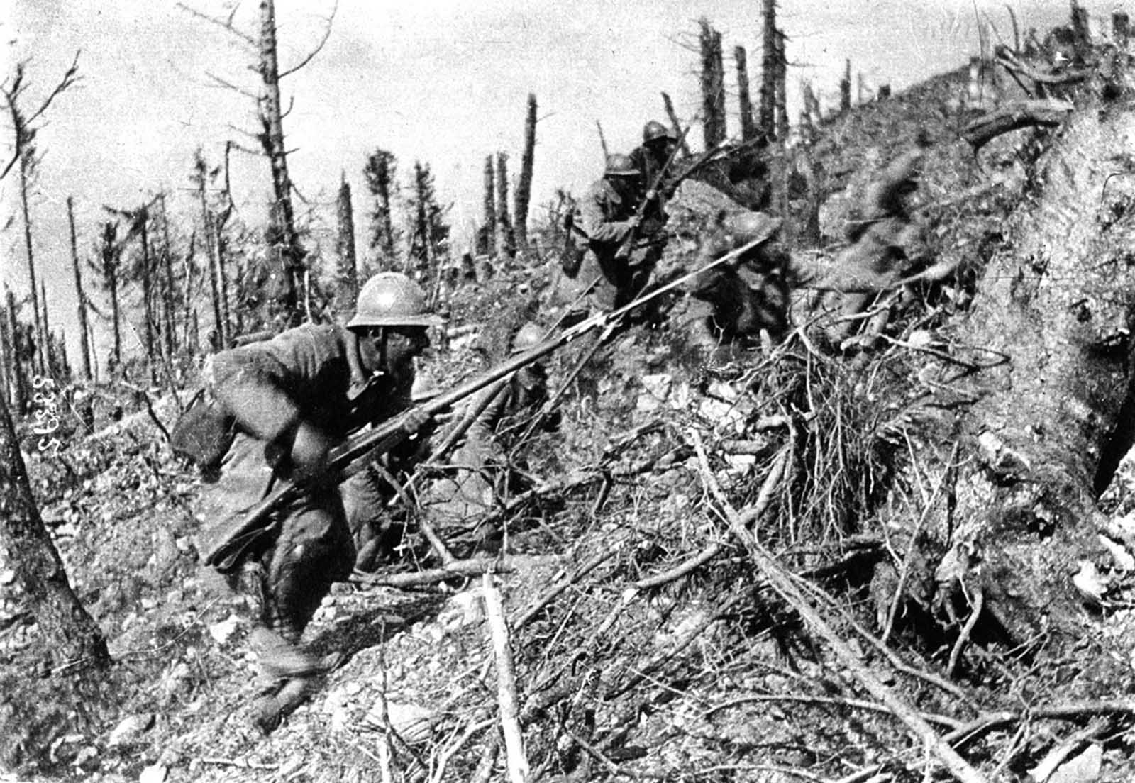 French soldiers in a bayonet charge, up a steep slope in the Argonne Forest in 1915. During the Second Battle of Champagne, 450,000 French soldiers advanced against a force of 220,000 Germans, momentarily gaining a small amount of territory, but losing it back to the Germans within weeks. Combined casualties came to more than 215,000 from this battle alone.