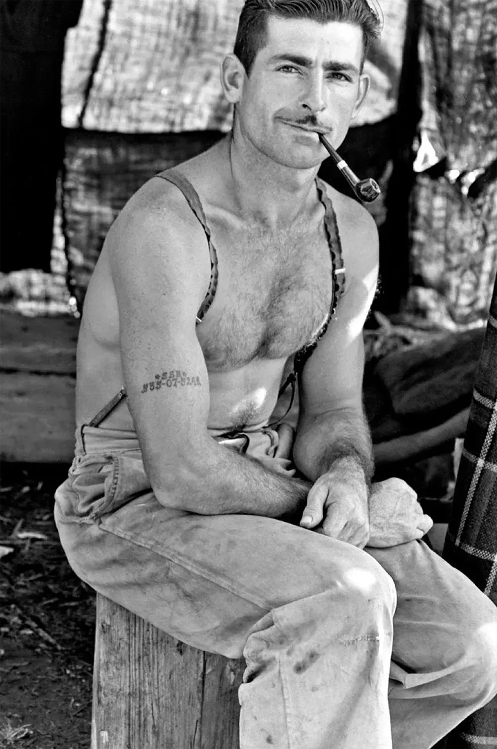 The Iconic Unemployed Worker with a Social Security Tattoo: The Story Behind One of the Most Striking Photos of the Great Depression