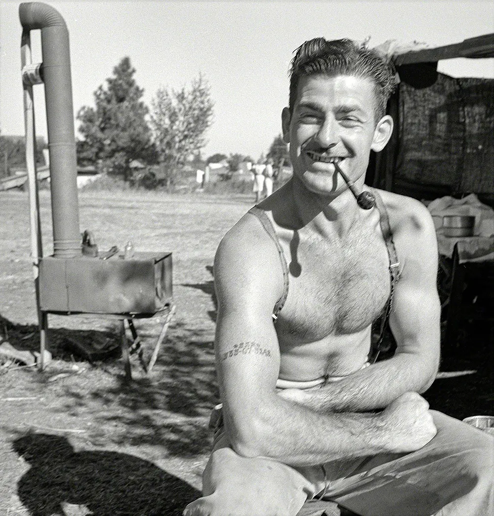 The Iconic Unemployed Worker with a Social Security Tattoo: The Story Behind One of the Most Striking Photos of the Great Depression