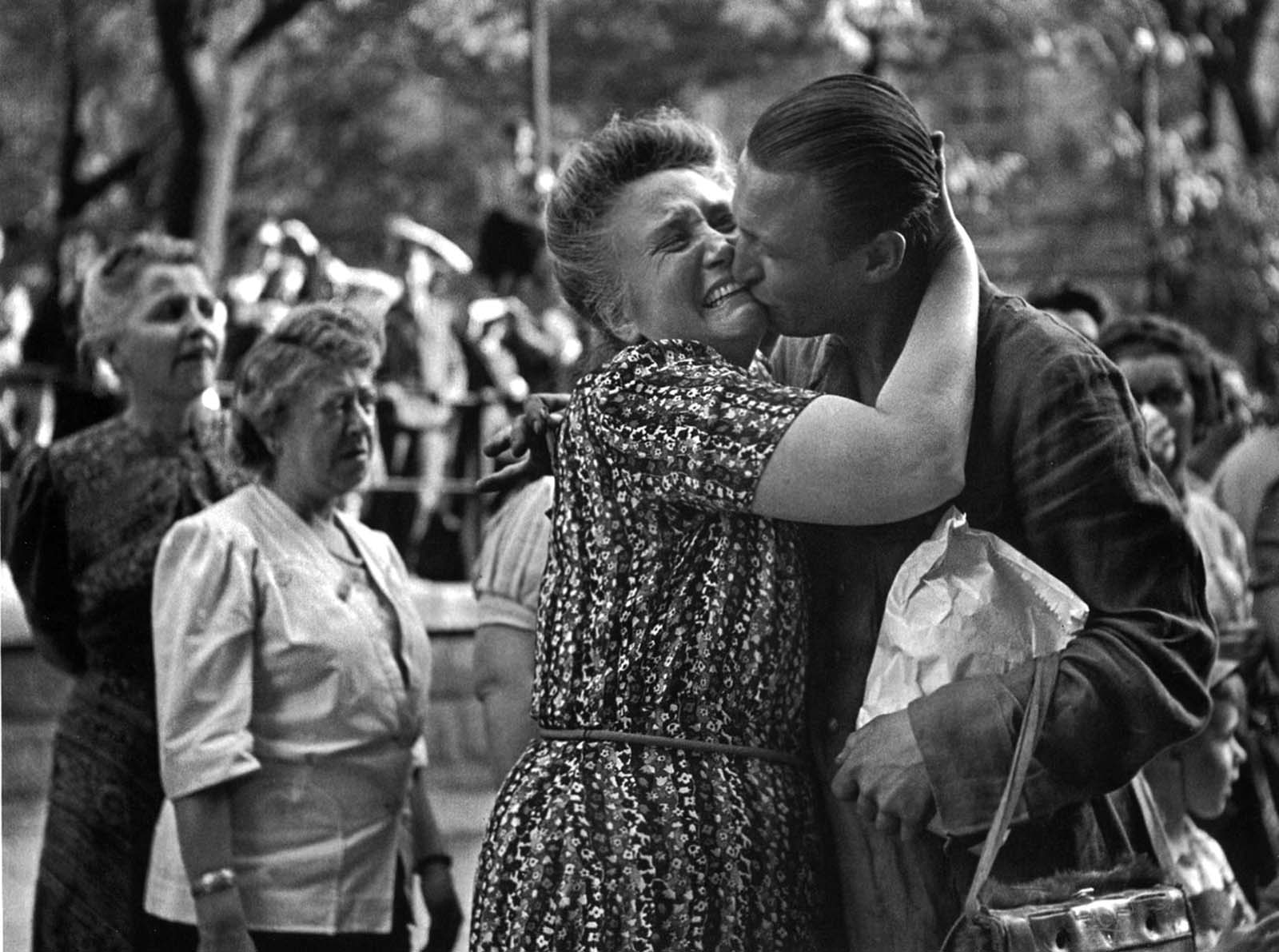 A woman greets her son, an Austrian prisoner of war returning home to Vienna.