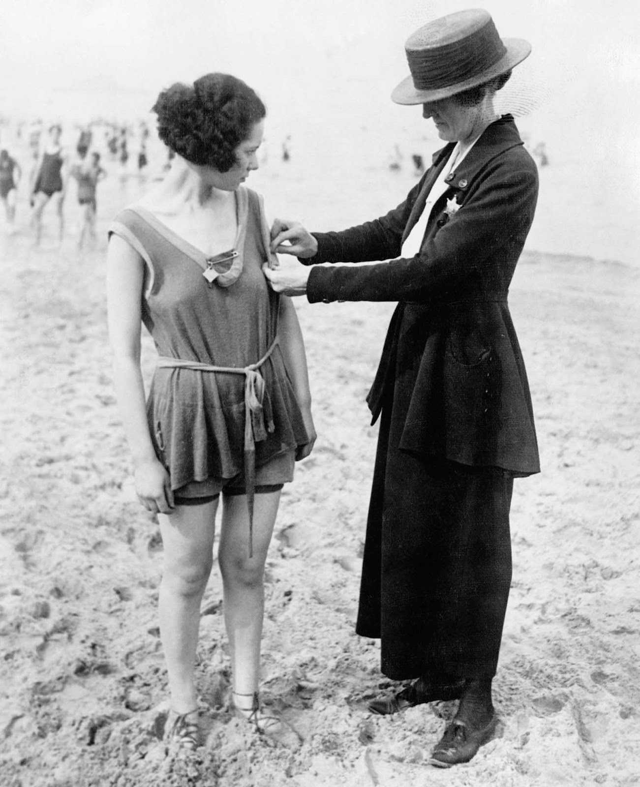 Chicago policewomen checking for violations of the bathing suit-length laws. 1922.