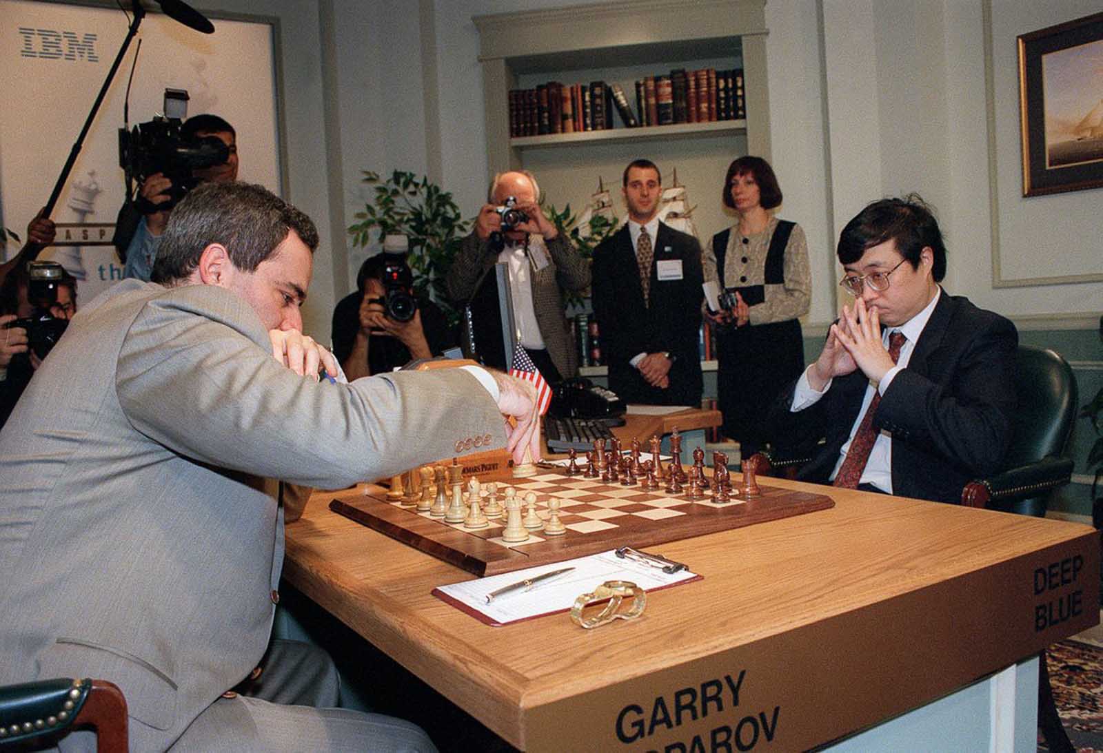 Kasparov moves his first piece, a knight, in the first game of the rematch.