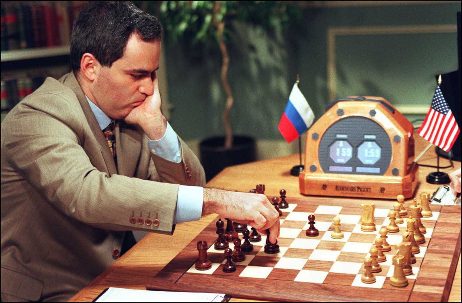 Kasparov makes a move in Game 2.