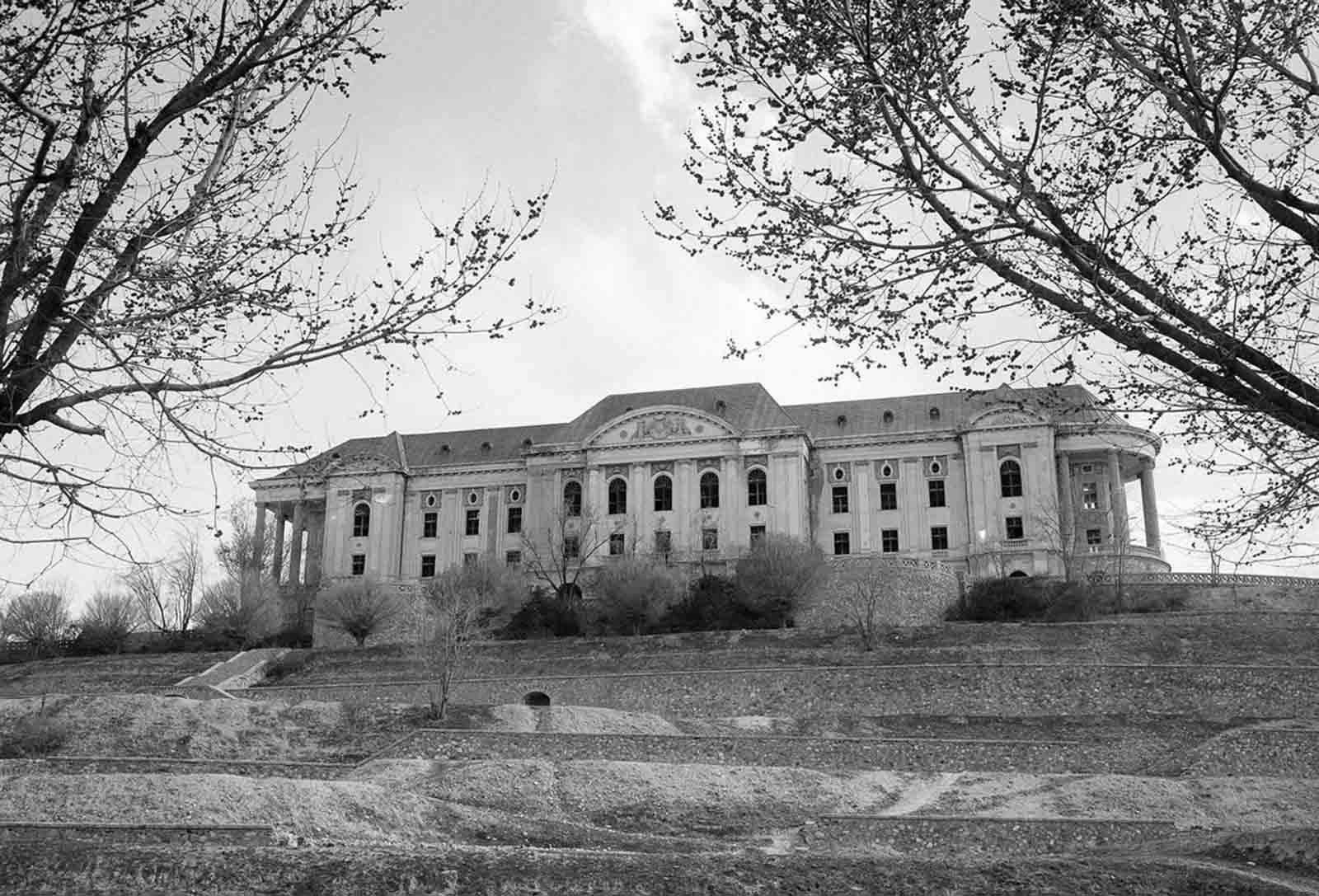 Tajbeg (Queen's) Palace, the Palace of Amanullah Khan in Kabul, photographed on October 8, 1949. Amanullah Khan, King of Afghanistan in the early 20th century, attempted to modernize his country and make many reforms to eliminate many age-old customs and habits. His ambitious plans and ideas were based on what he had seen during a visit to Europe.