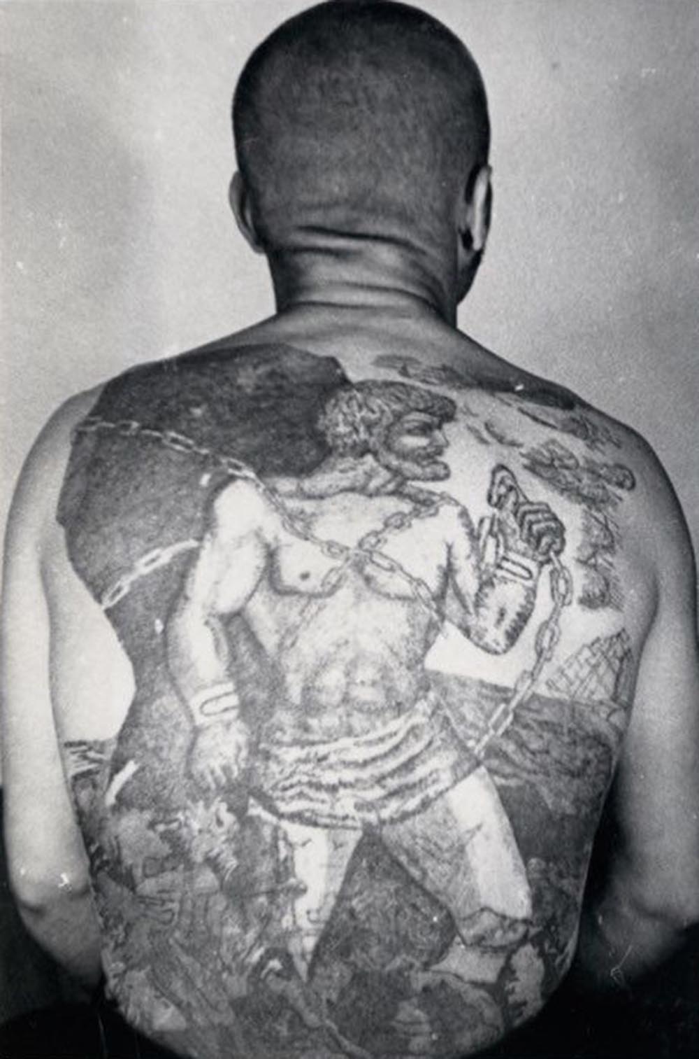 This tattoo is a variation on the myth of Pometheus, who, after tricking Zeus, is chained to a rock in eternal punishment. The sailing ship with white sails means the bearer does not engage in normal work; he is a traveling thief prone to escape.