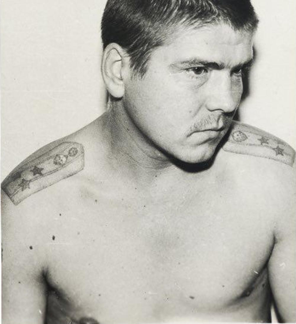 The design of epaulettes tattooed on the shoulders is adapted either from a pre-Revolutionary uniform or an existing Soviet one; both indicate the bearer has a negative attitude toward the system. They are worn by high-ranking criminals who might also have a corresponding nickname, such as ‘major’ or ‘colonel.' Epaulettes with three little stars or skulls are deciphered as: ‘I am not a slave of the camps; no one can force me to work;' ‘I am captive, but I was born free;' ‘I’m a colonel of the zone — I will not sully my hands with a wheelbarrow;' ‘The strong win — the weak die;' ‘Horses die from work.'