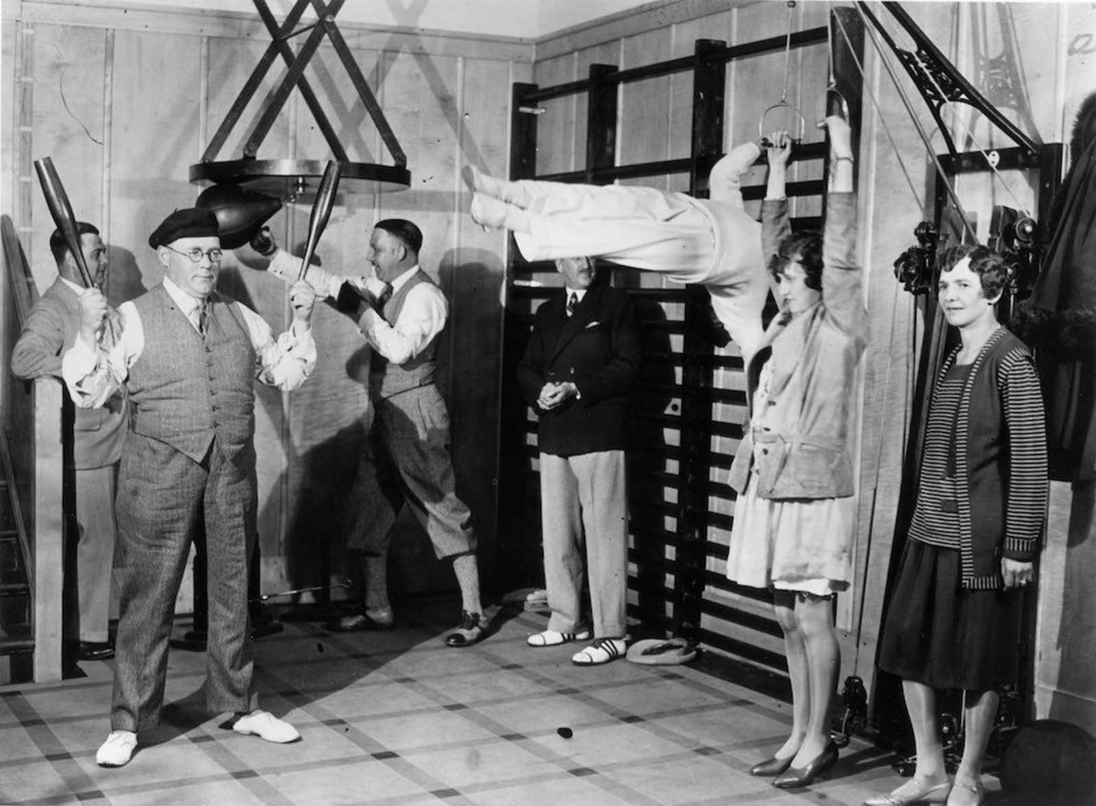Passengers on the Canadian Pacific liner Duchess of Bedford keep fit in the ship's gymnasium. Dec, 1931.
