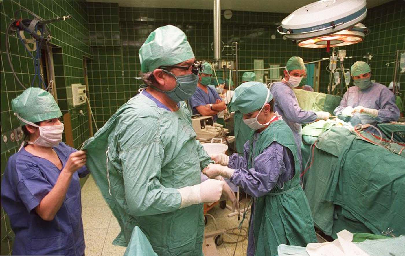 Dr. Religia getting his scrubs on before the operation.