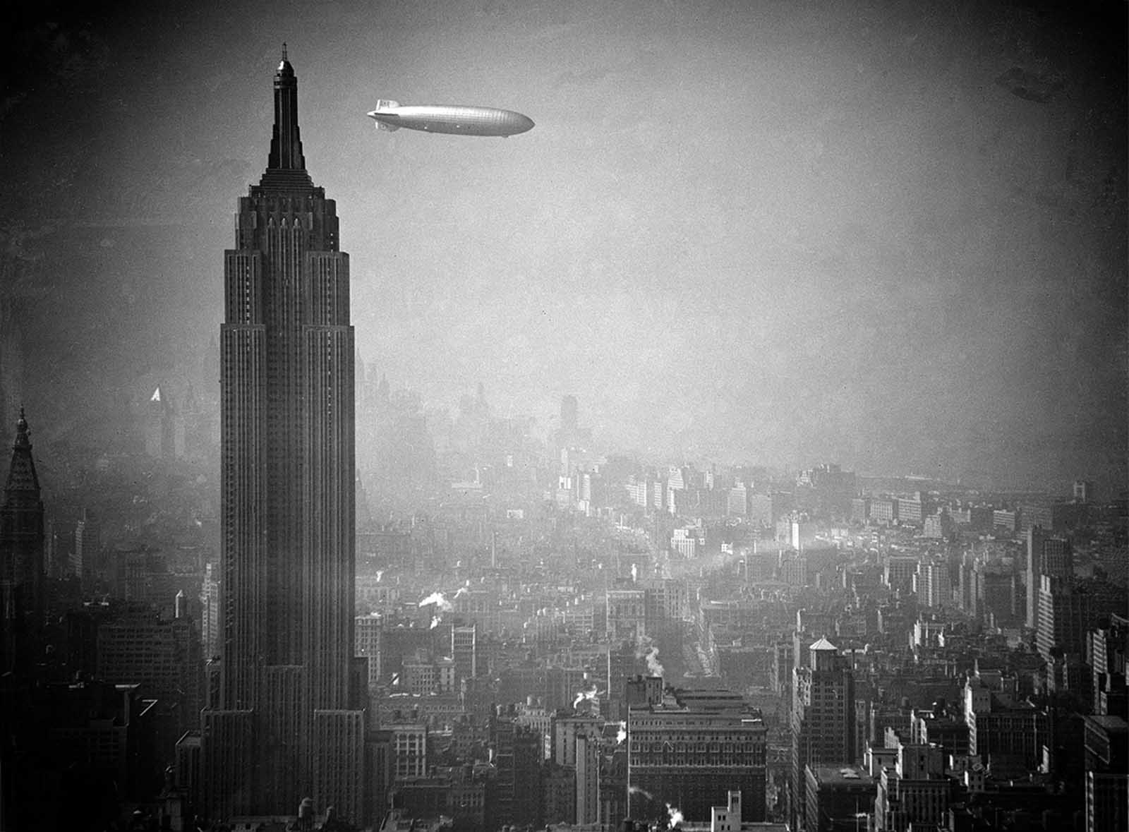 The Hindenburg floats past the Empire State Building over Manhattan on August 8, 1936, en route to Lakehurst, New Jersey, from Germany.