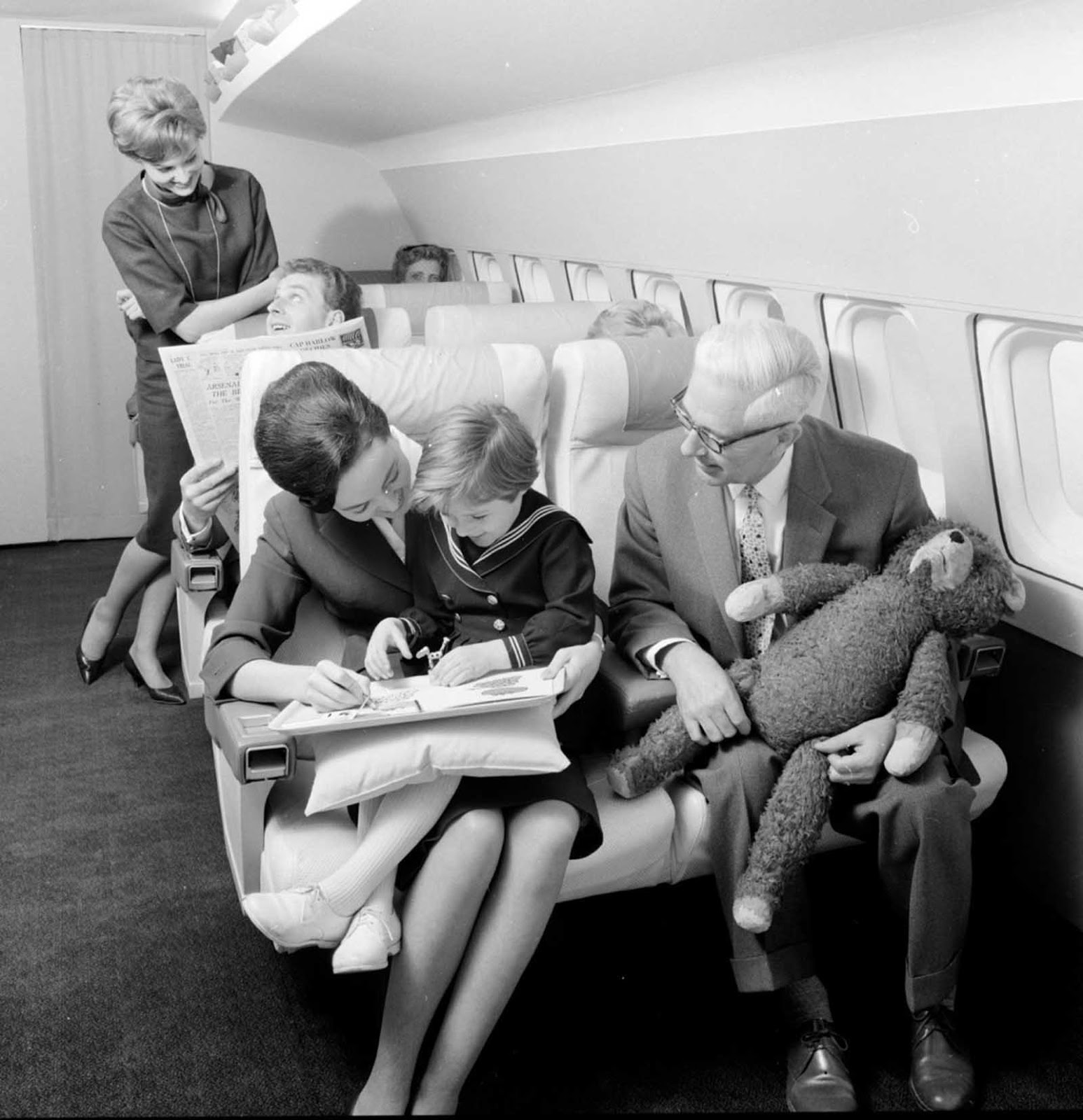 A couple flying first class in 1960s.