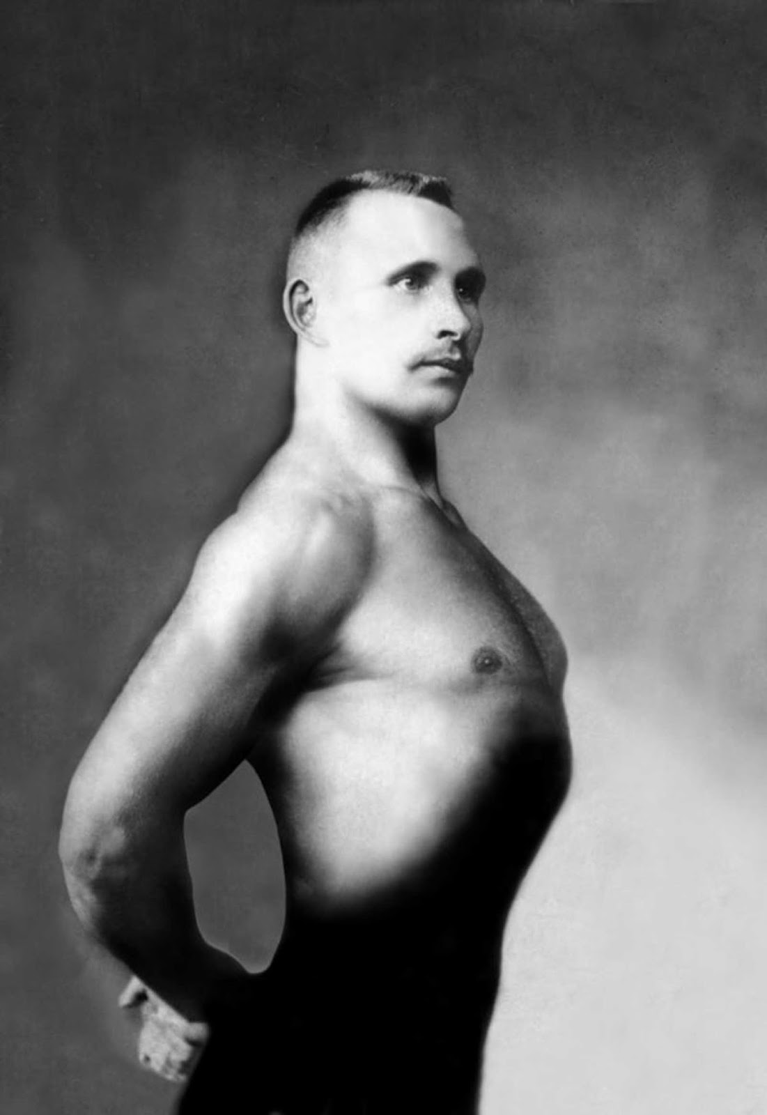A Russian bodybuilder, photographed in a studio circa 1900.