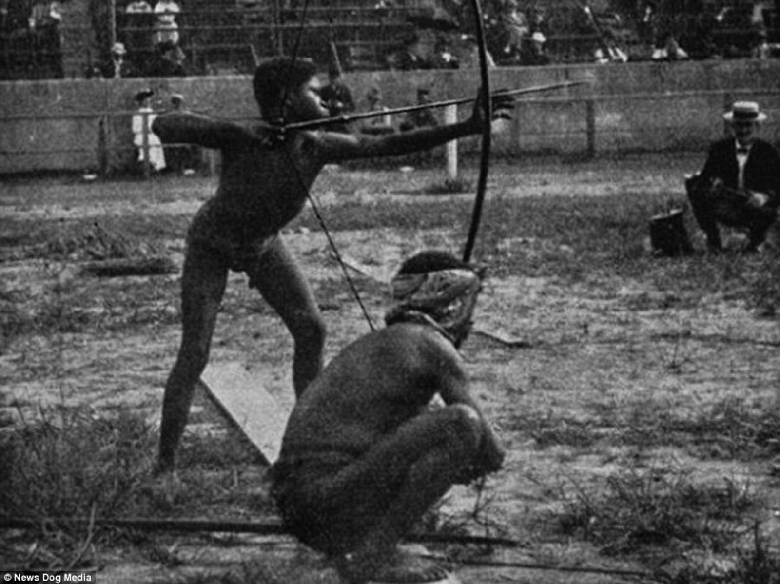 In this image, indigenous people are shown participating in archery in 1904 in St Louis, Missouri, at an event named the 'Savage Olympics Exhibition'.