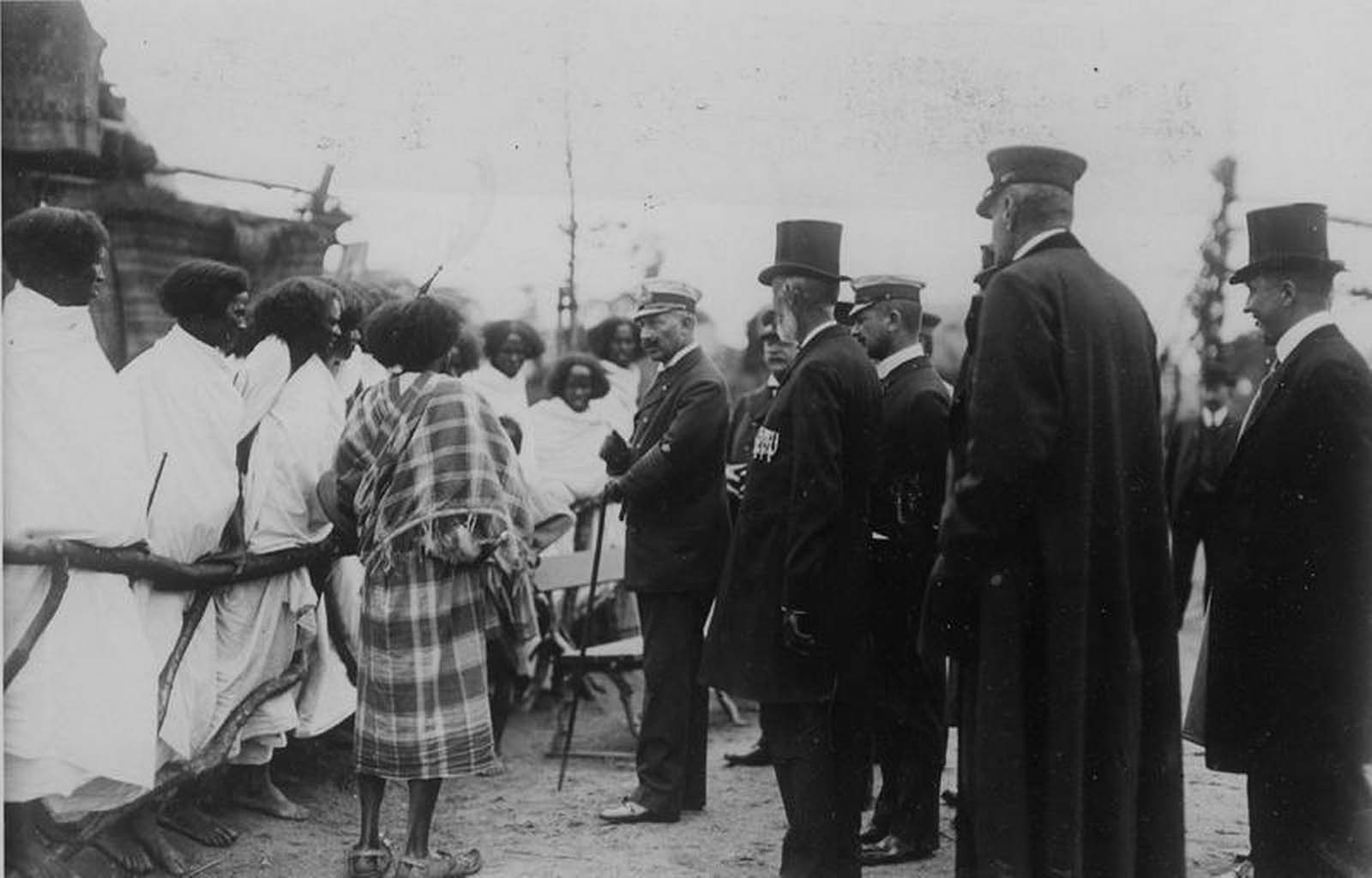 Germany's Kaiser Wilhelm II is pictured meeting Ethiopians standing behind a wooden fence in Hamburg, Germany in 1909.
