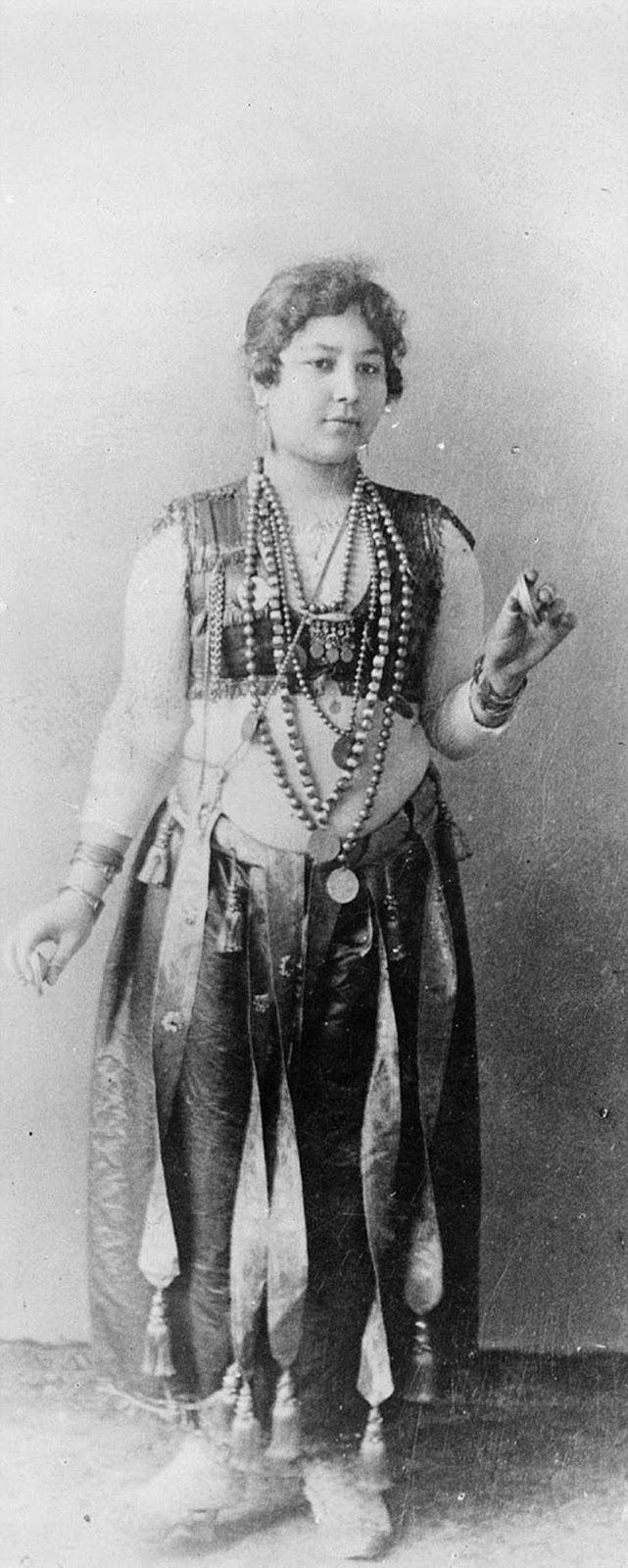 An Egyptian dancing girl at the World's Columbian Exposition, Chicago, Illinois, USA, circa 1893.