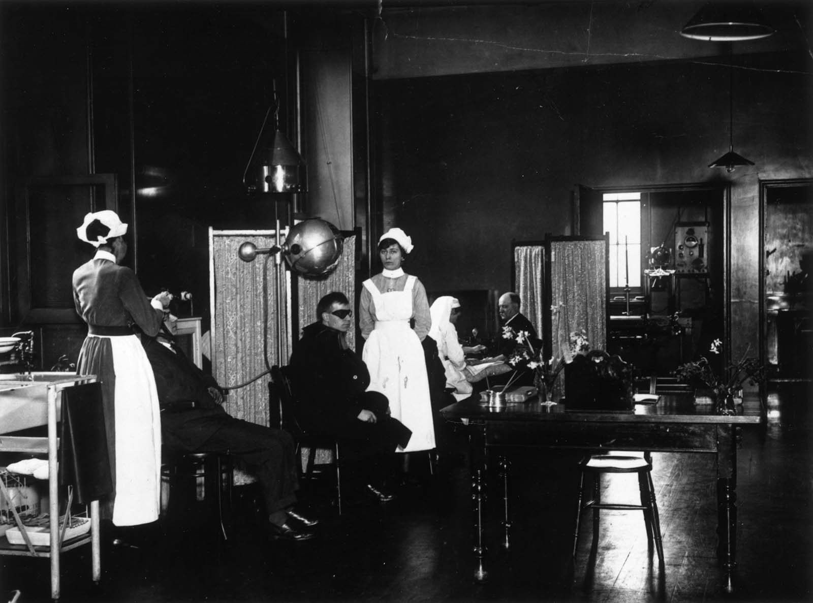 Patients receiving treatment in the Electrical Department of St George’s Hospital, Hyde Park Corner, London. 1921.