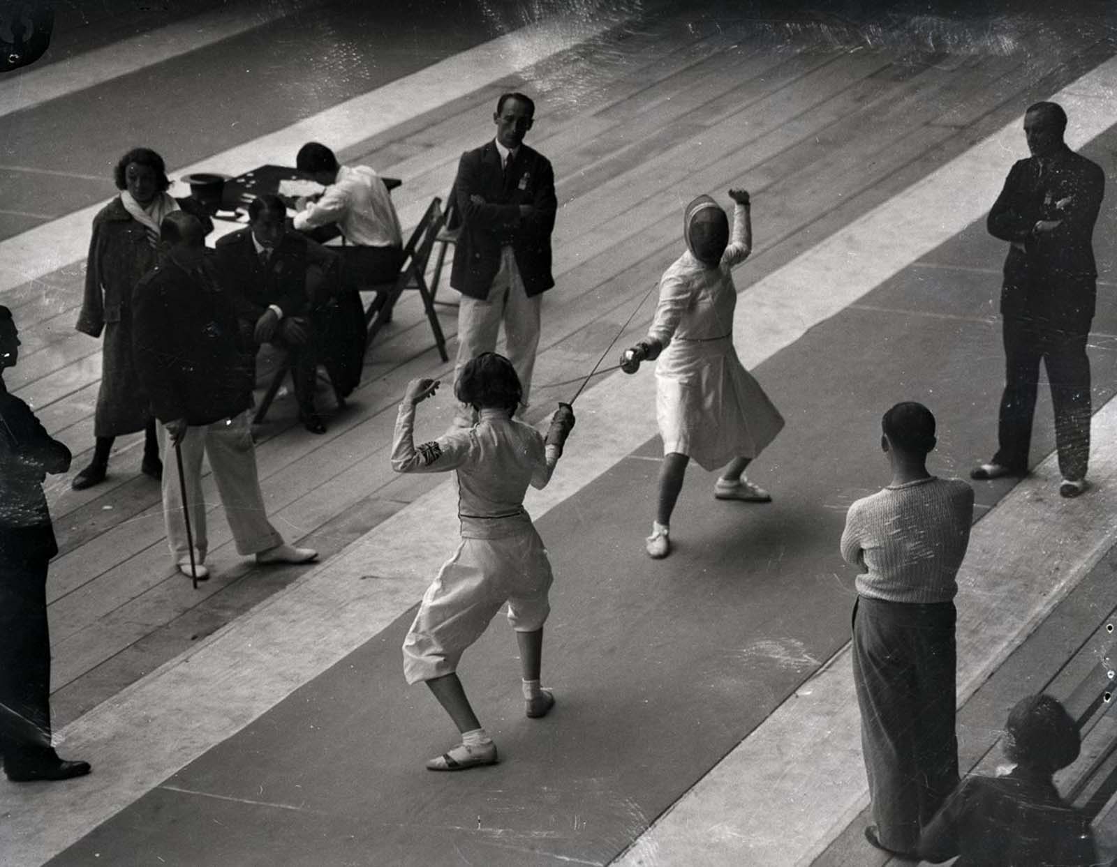 Mayer competes against Judy Guinness of Great Britain in the Los Angeles Olympics. 1932.