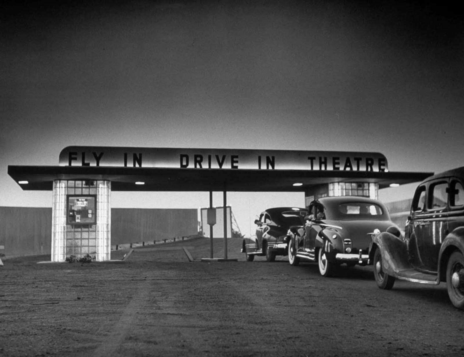 Some customers arriving by car at area Fly-In Drive-In Theatre.