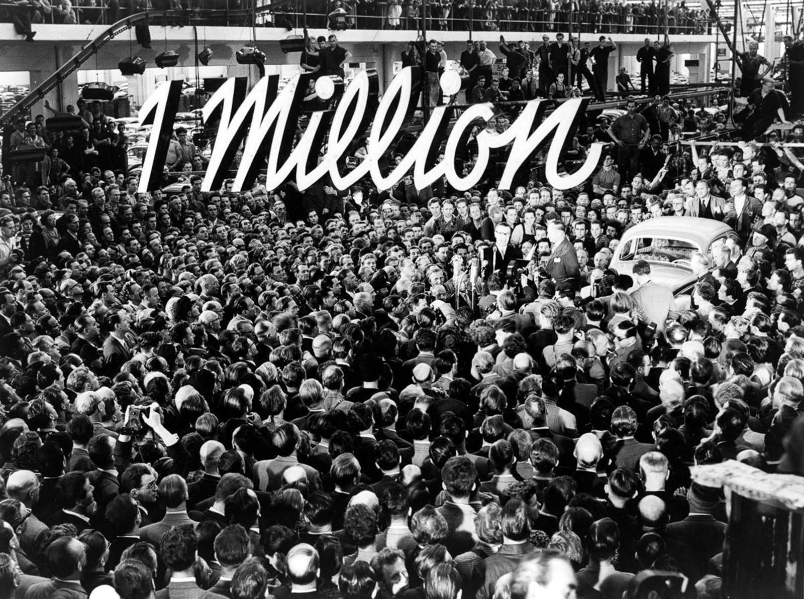 Volkswagen celebrates the production of the company's millionth Beetle. 1955.