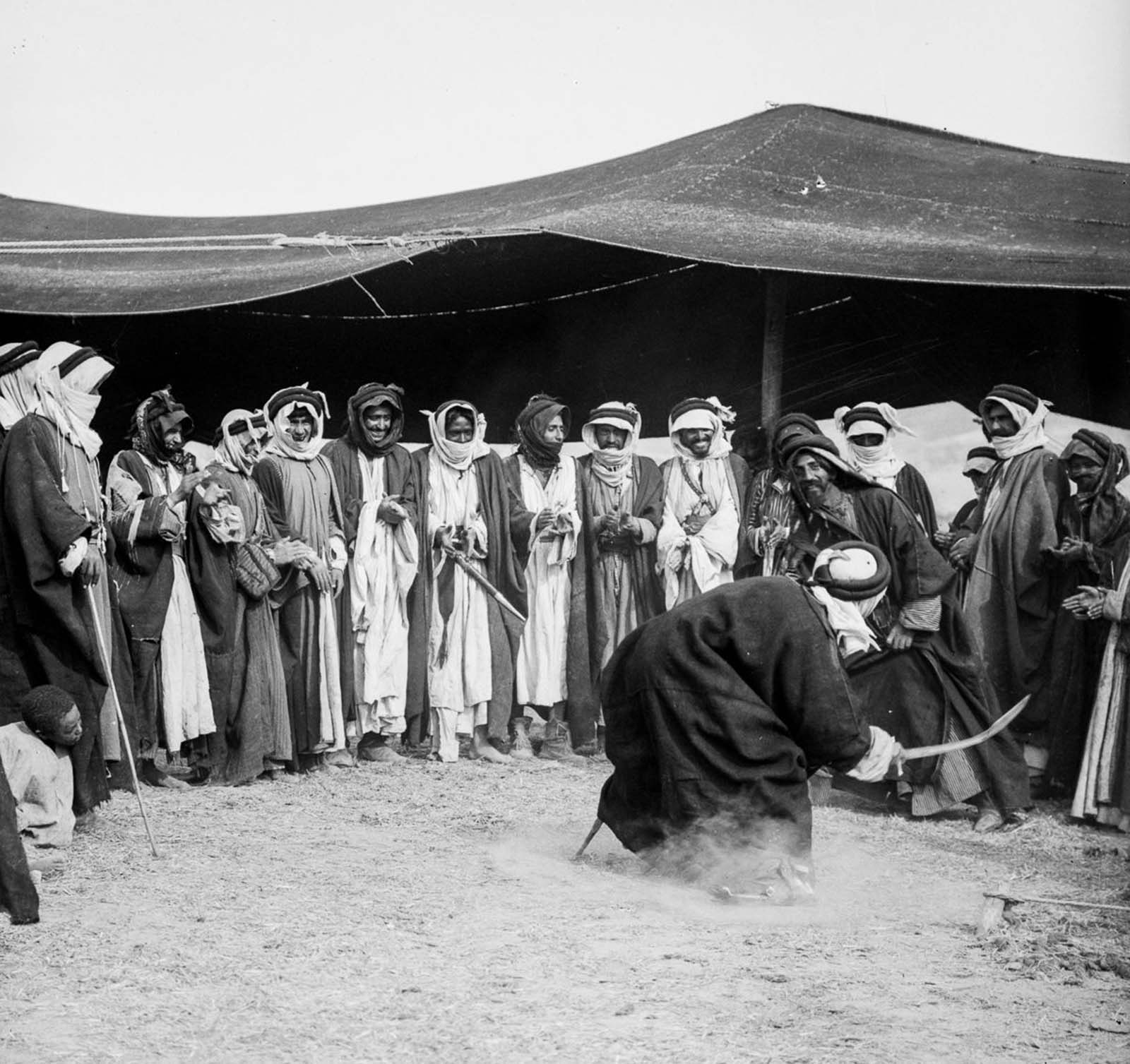 Men perform a sword dance at a wedding.