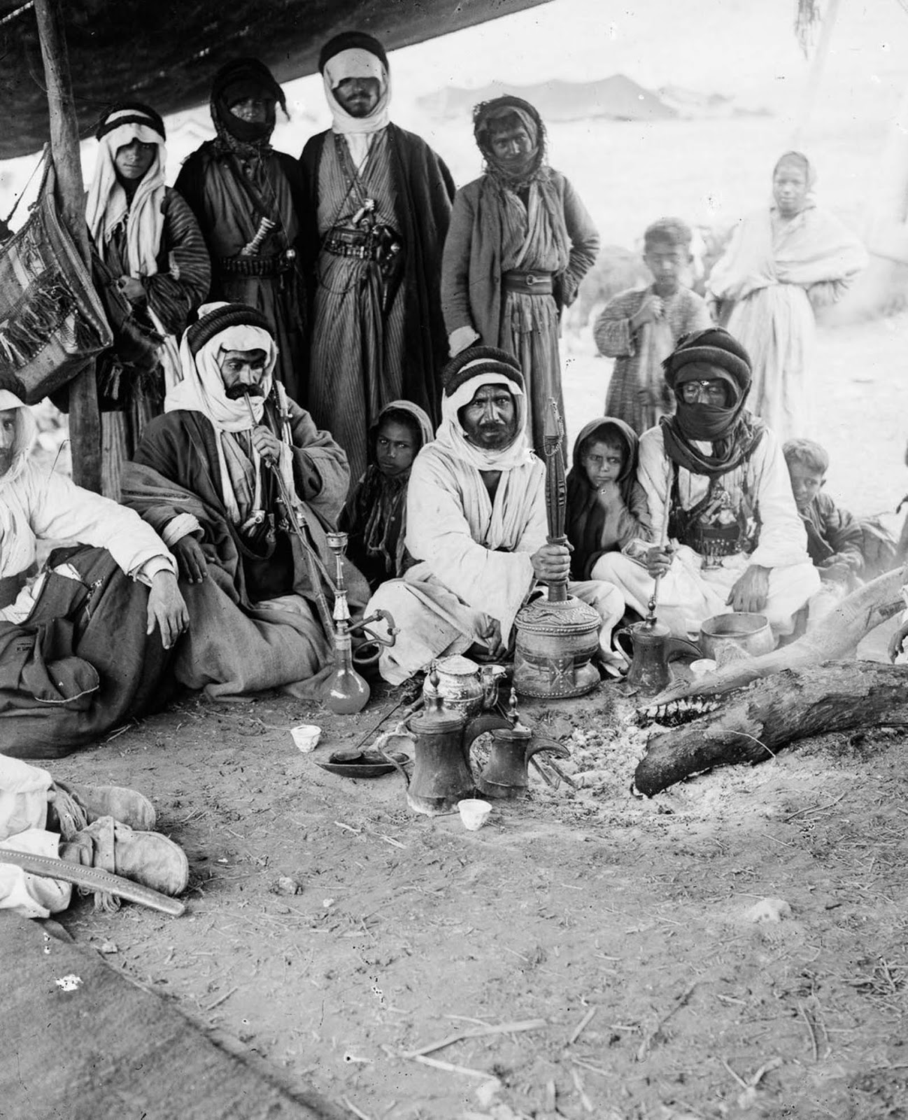 Bedouin men smoking.