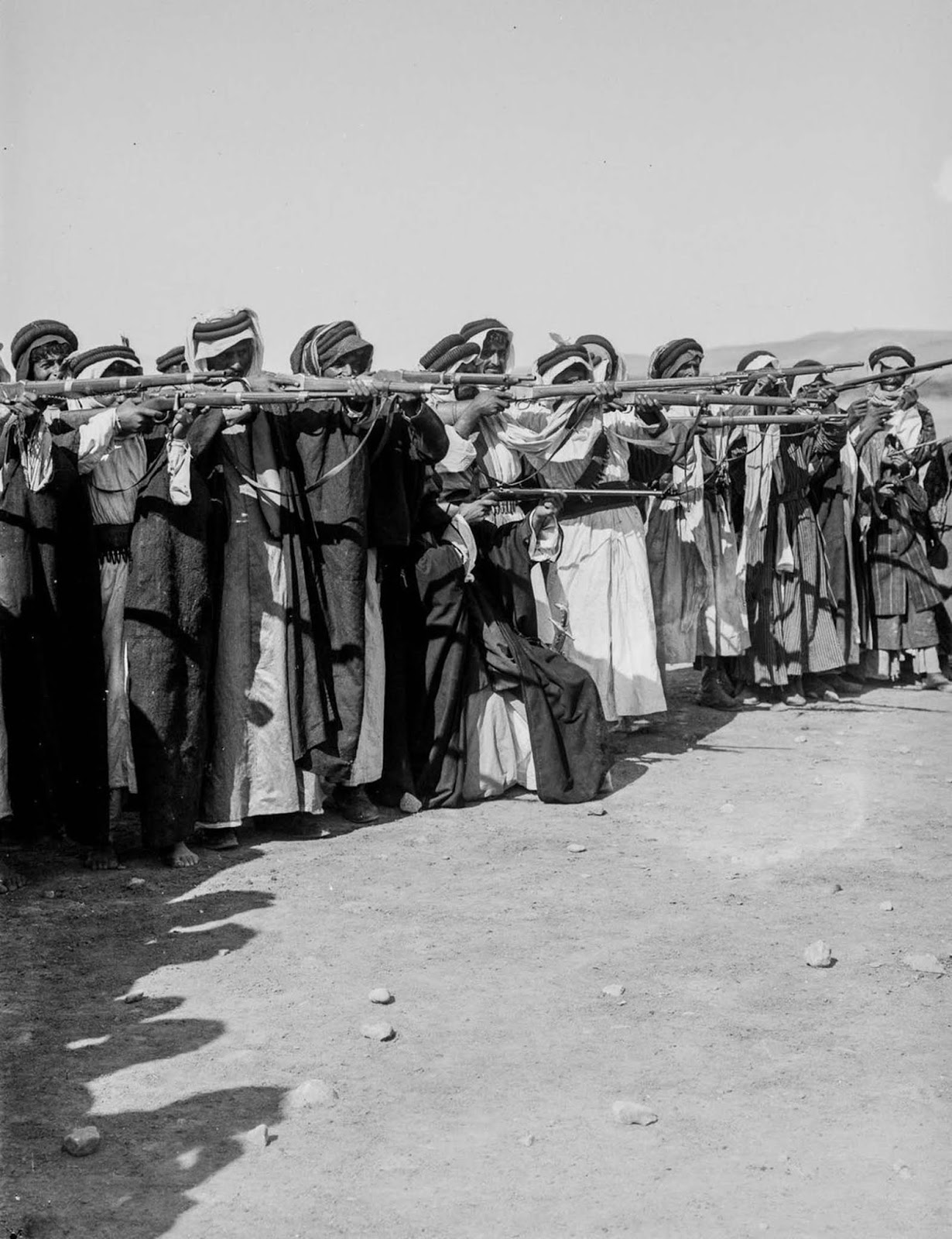 Men participate in a shooting competition.