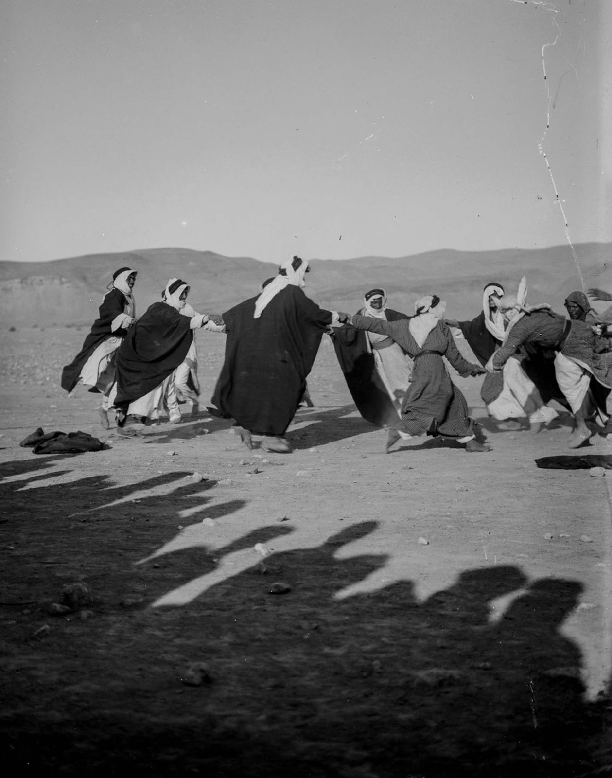Men dance during wedding celebrations.