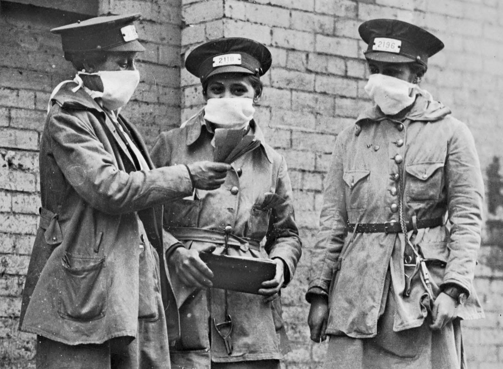 New York City conductorettes wear masks, on October 16, 1918.