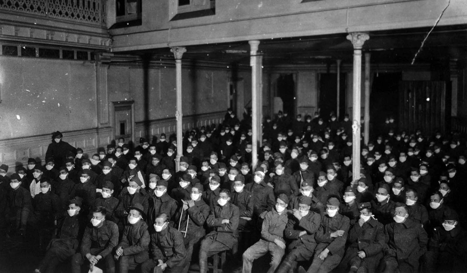 Patients at a moving-picture show wear masks in Royat, France.