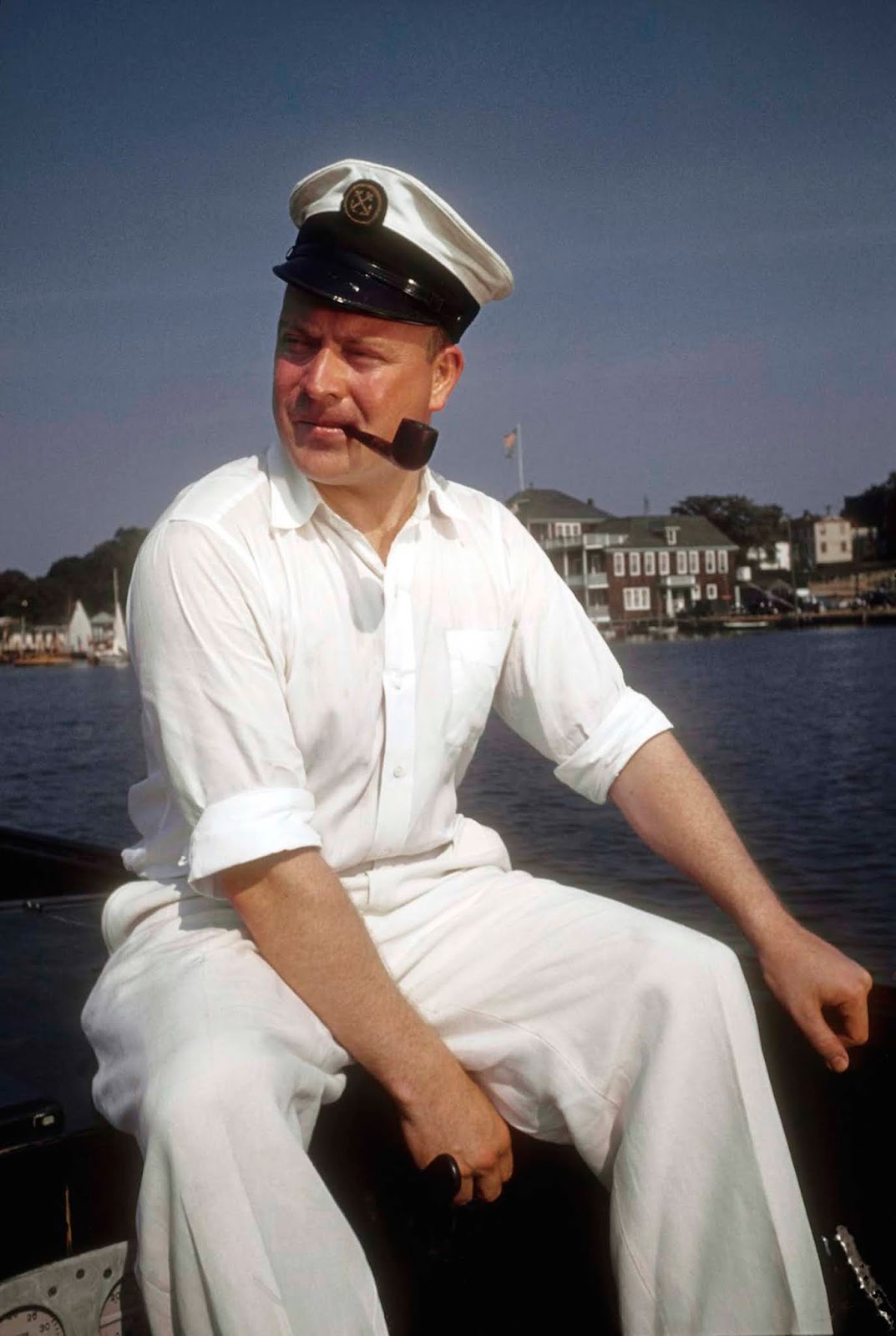An ad man takes to the water in his boat to relax, leaving the strain of the office behind -- but not his pipe.