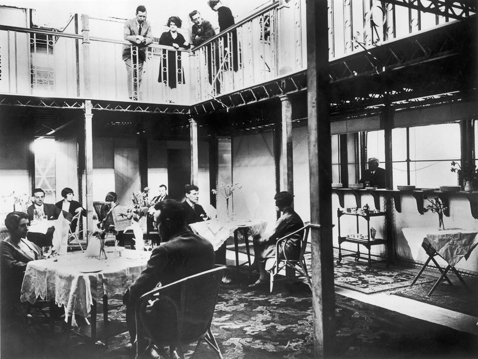 Passengers hang around the salon and upper gallery. 1930.