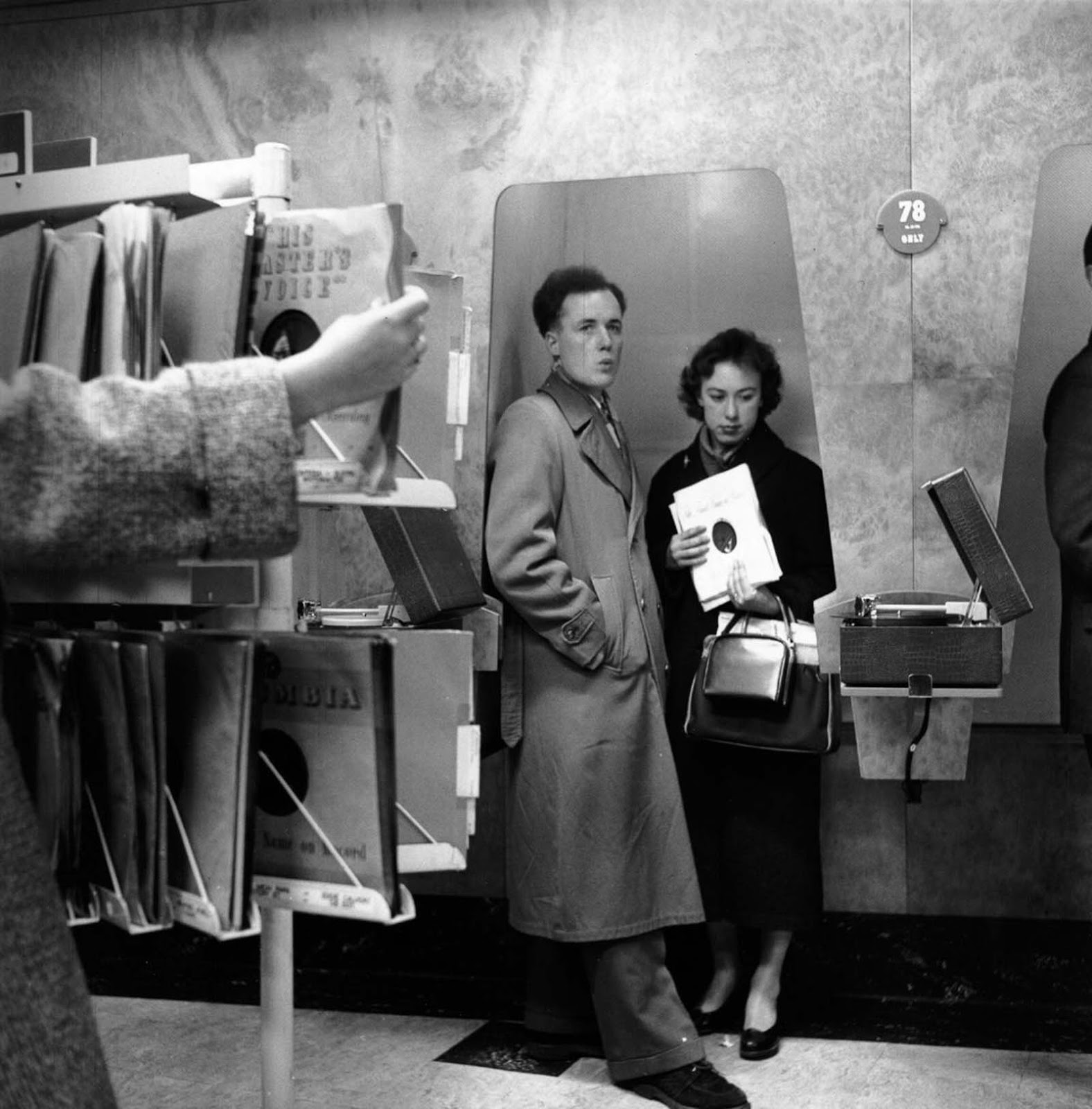Picking up a vinyl record. 1955.