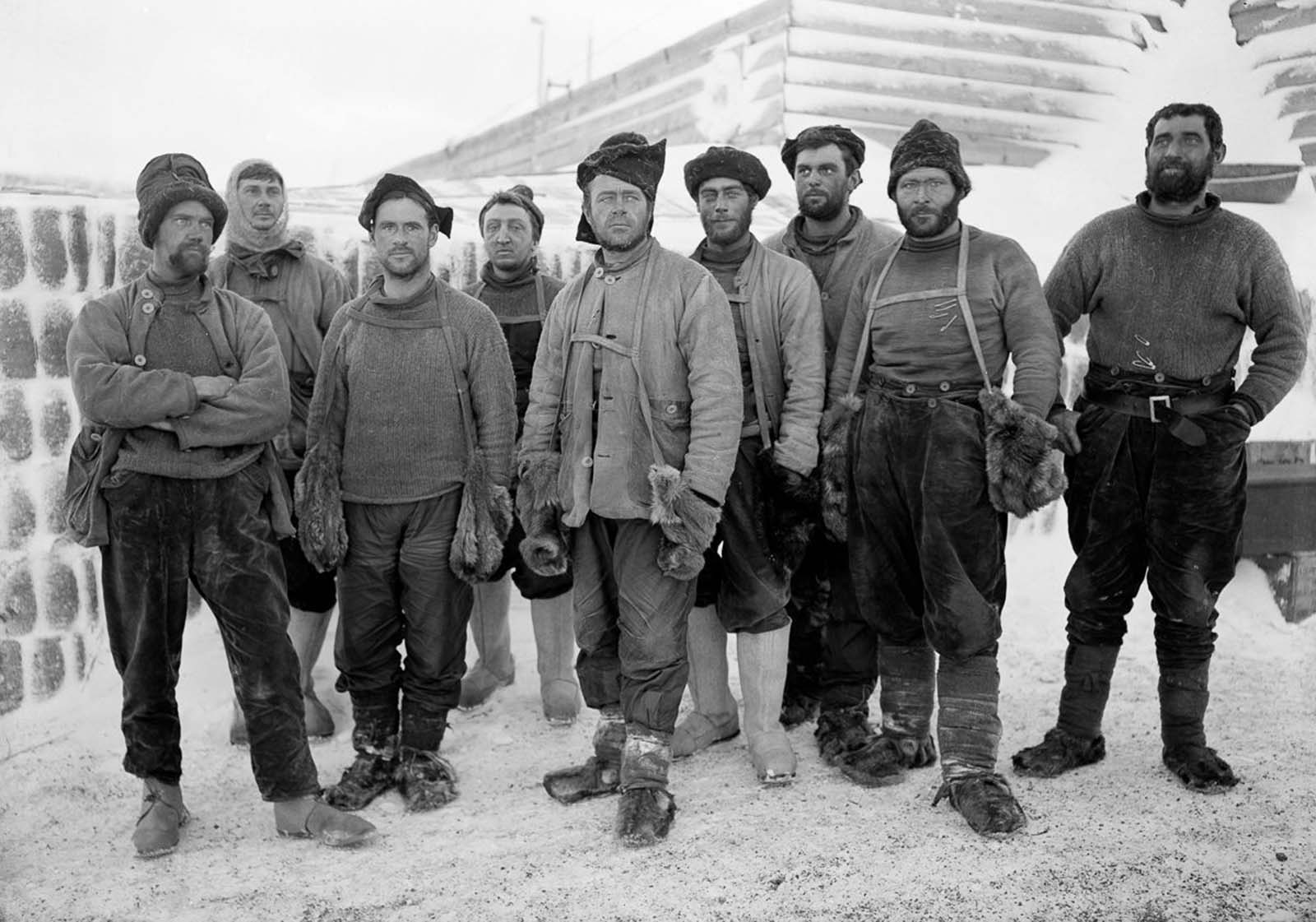 Capt. Scott and other expedition members pose at camp after returning from the depot-laying expedition. April, 1911.