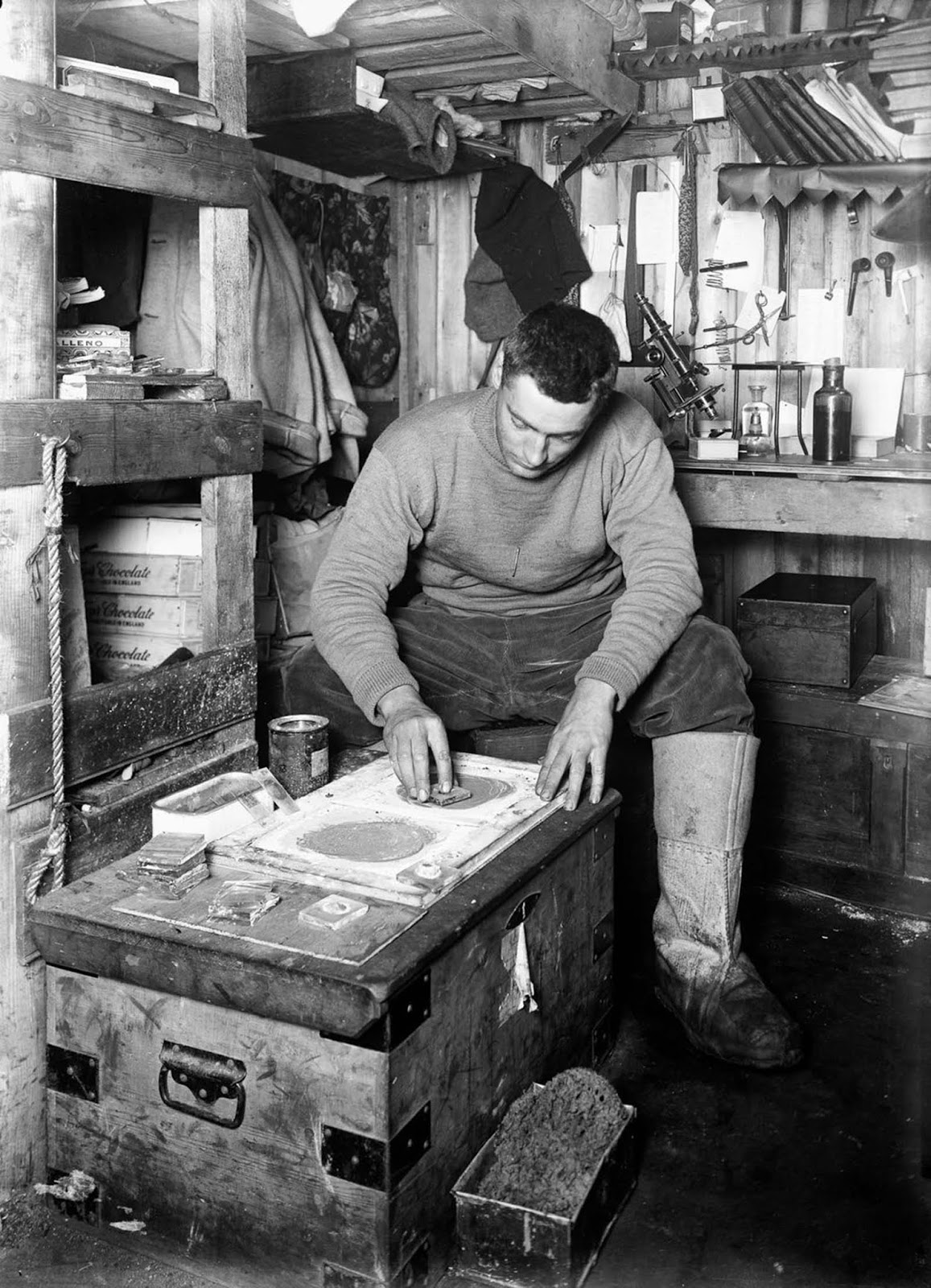Geologist Frank Debenham grinds stone samples. June 12, 1911.