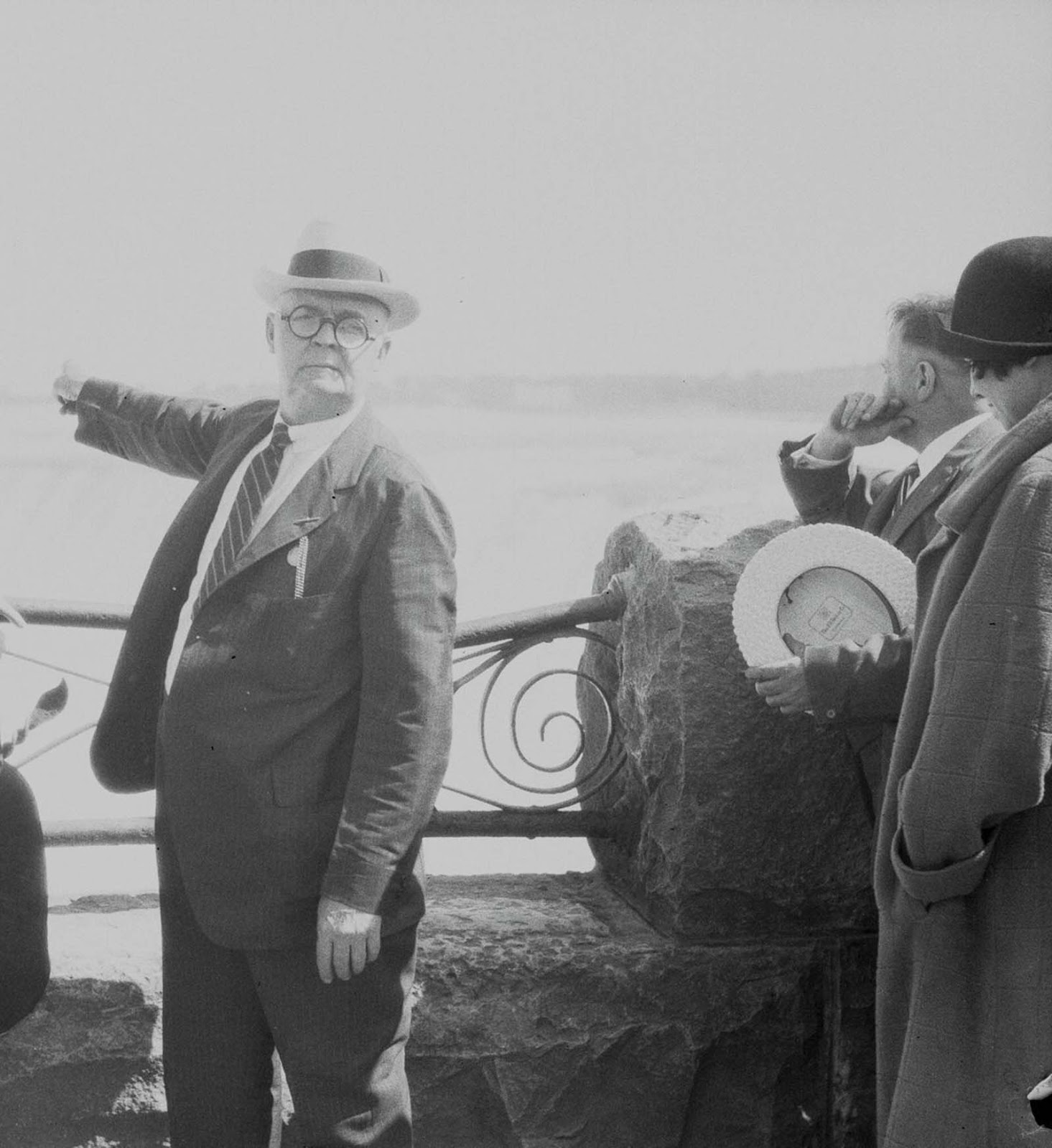 Bobby Leach points to where he went over the falls in 1911. 1925.