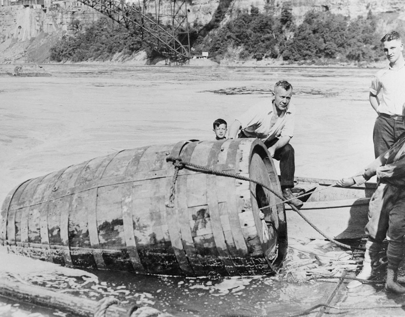 The body of George Stathakis is recovered from his one-ton barrel after going over the falls and becoming trapped for more than 18 hours. 1930.