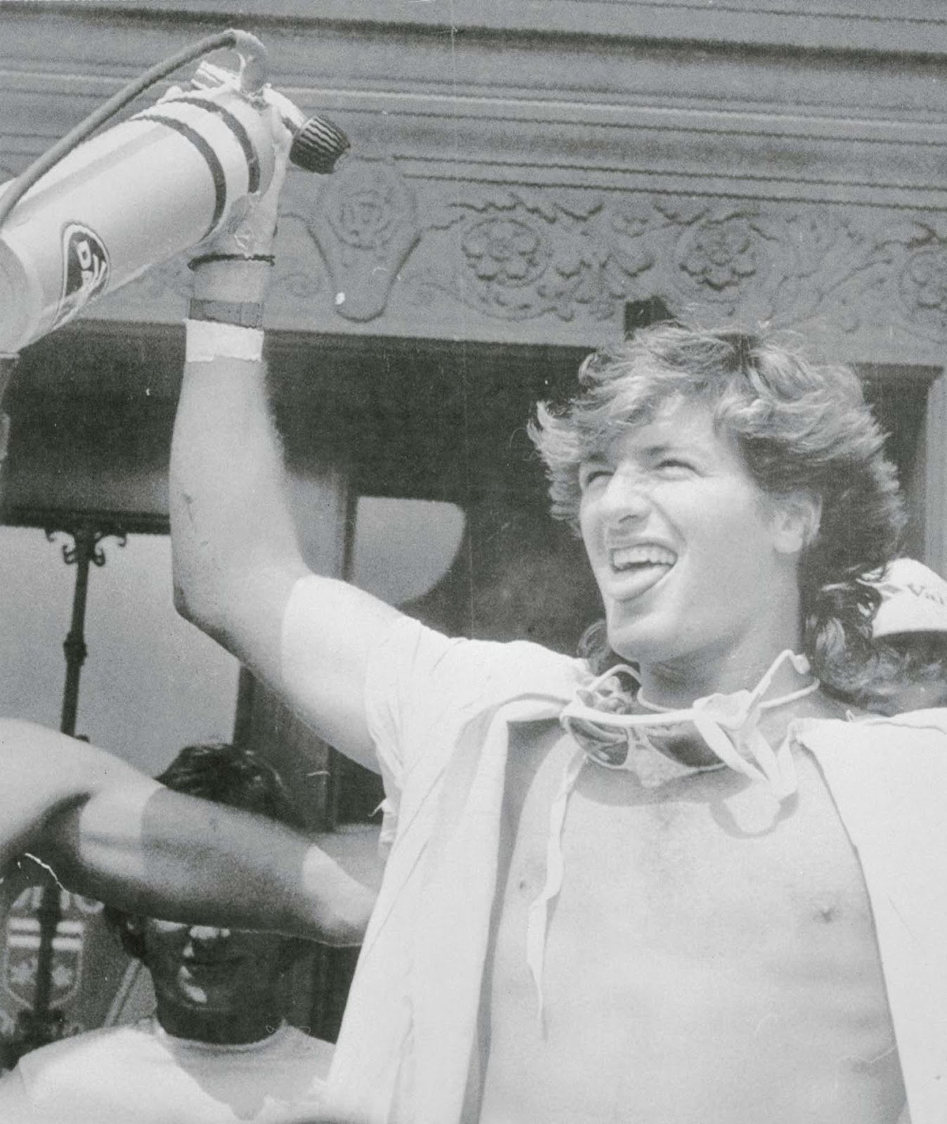 Steven Trotter waves one of the oxygen bottles he took with him over the falls. 1985.
