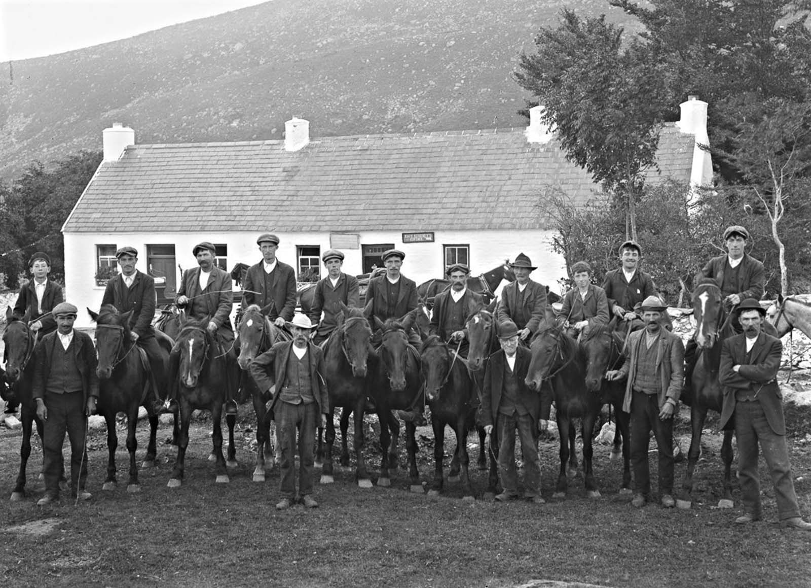 Men on horseback in front of Kate Kearney's Cottage in Kerry. 1900.