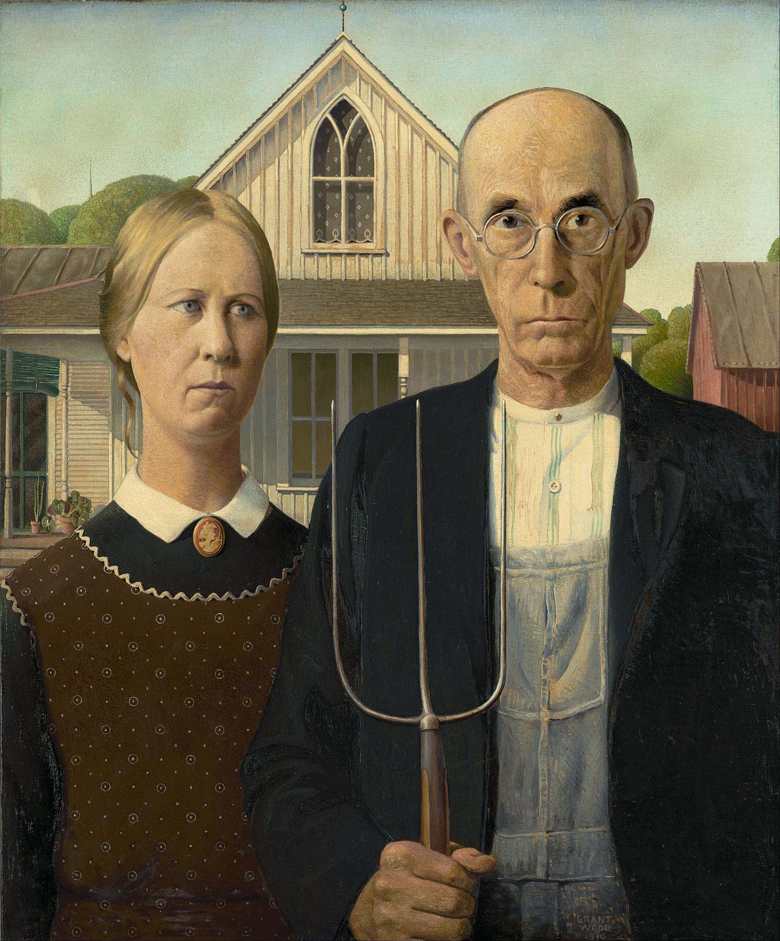 The models for ‘American Gothic’ pose in front of the iconic painting, 1942