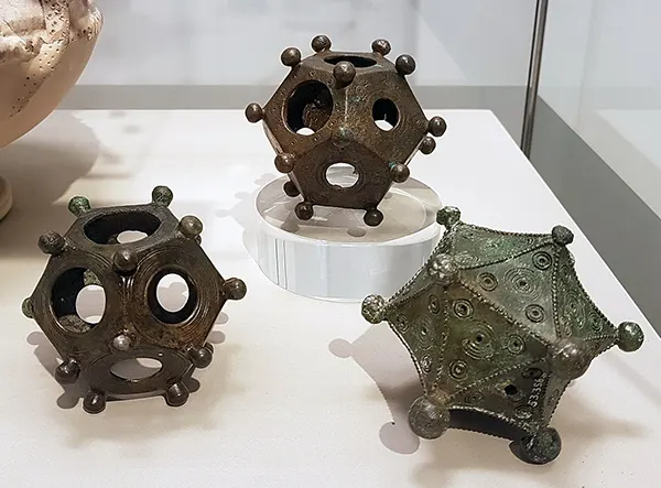 Two dodecahedra and an icosahedron on display in the Rheinisches Landesmuseum Bonn, Germany.