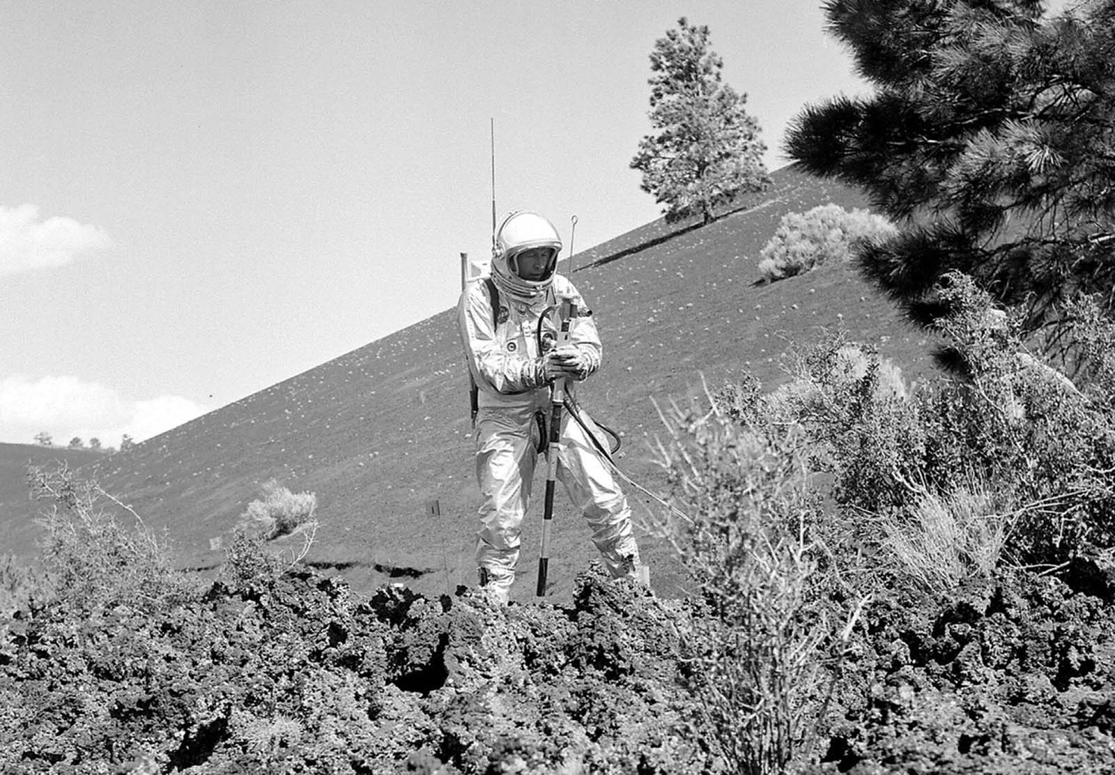 A suited subject stands on the edge of the Bonito Lava Flow near Arizona's Sunset Crater volcano, with an early concept of a